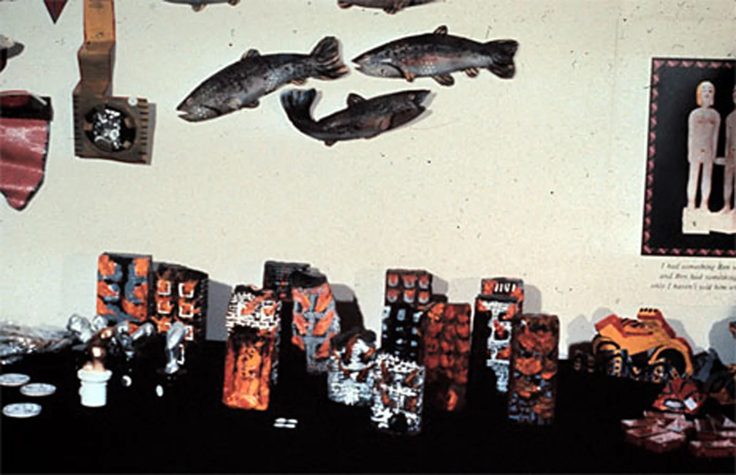 The A. More Store at the Jack Tilton Gallery, 1983-84. Fish by Christy Rupp (on wall), Bricks by Tim Rollins and students (on table)