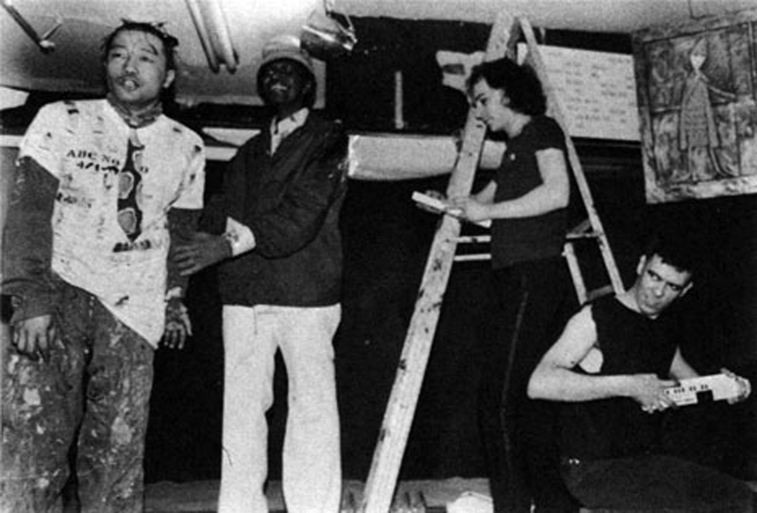 Samoa, a Japanese performer and musician, performs with Frederick Nunnely on stage at No Rio. In the photo above, neighborhood character Phillipo barges in on Samoa's act just as he sings the lyric, "Somebody is living in my brain." Photo by Hector Gonzalez
