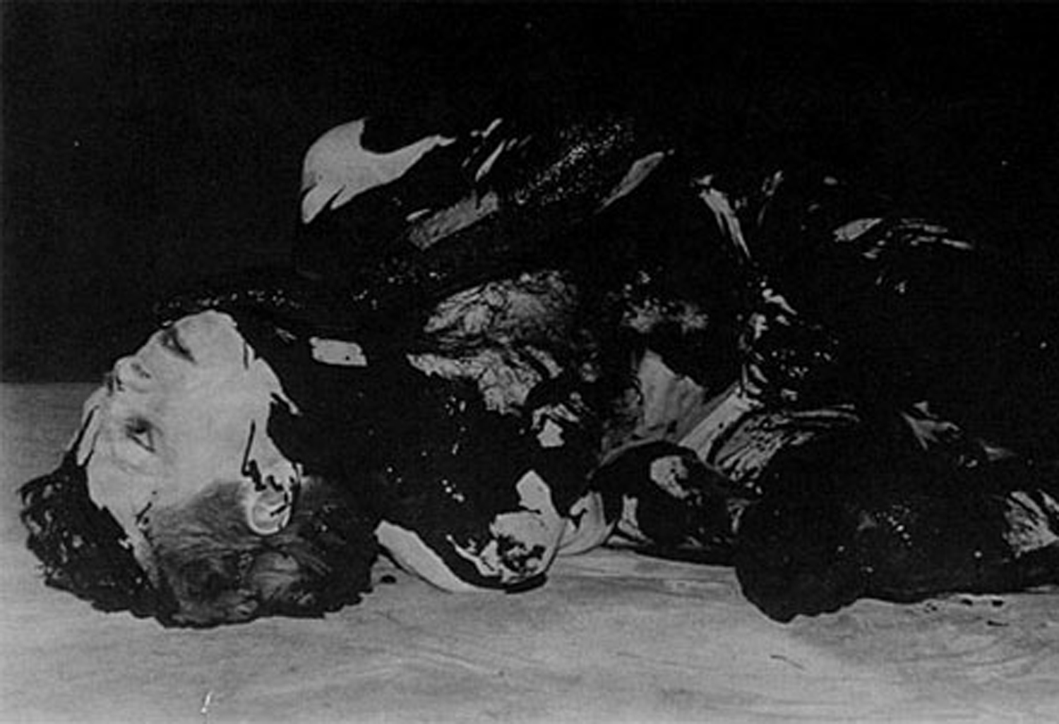 A solo danced by Peter Francis to a segment of Henry Miller's "Black Spring," an apocalyptic prose poem ("This is the spring that Jesus cried, the sponge to his lips..."). In the climax of the piece, Francis, suspended by a rope, descended into the stage trapdoor and emerged covered in black paint. Photo by Hector Gonzalez