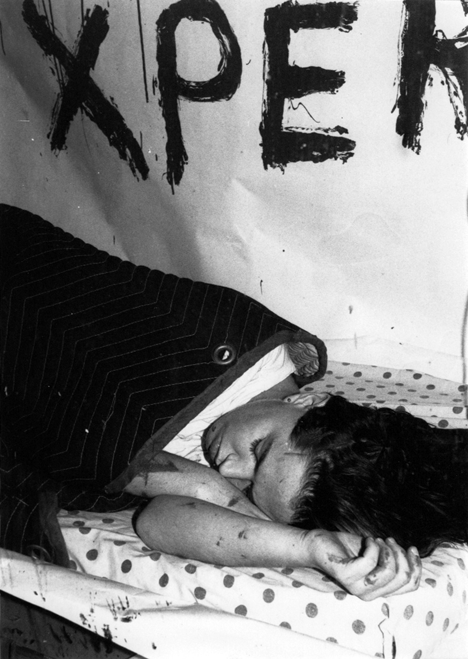 Kembra Pfahler sleeps in the window of ABC No Rio as part of her performance installation, "The New York Experience." Photo by Toyo