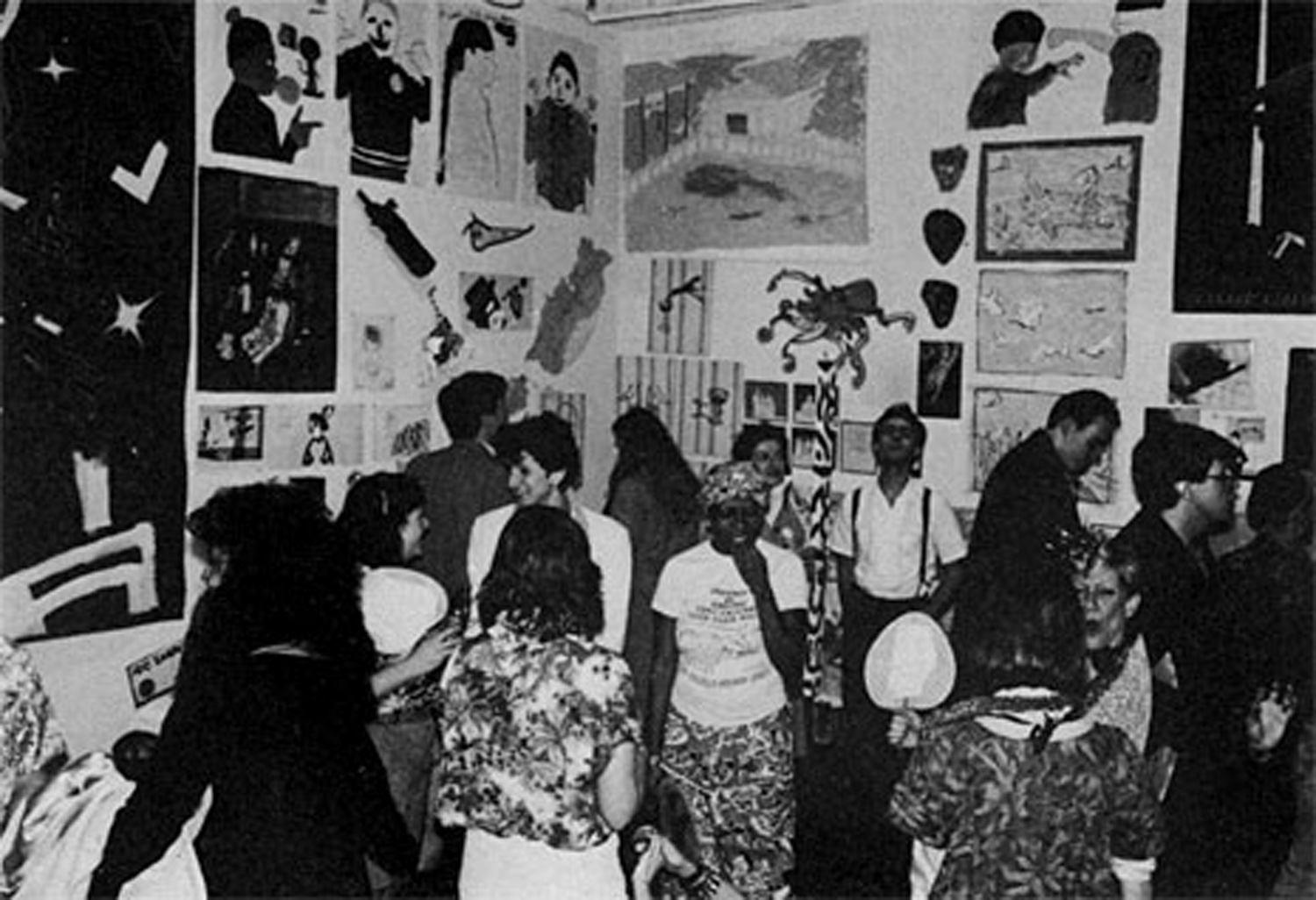 A view of the gallery hung with work from No Rio during Negative Utopia night