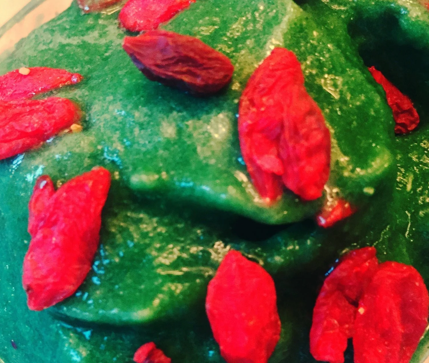 Goji berries make a healthy chewy topping on the green superfood ice cream.