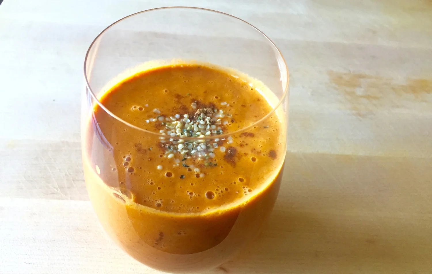 Top The Carrot, Cranberry, Apple "Pumpkin Pie" Smoothie with pumpkin pie spice and hemp seeds.