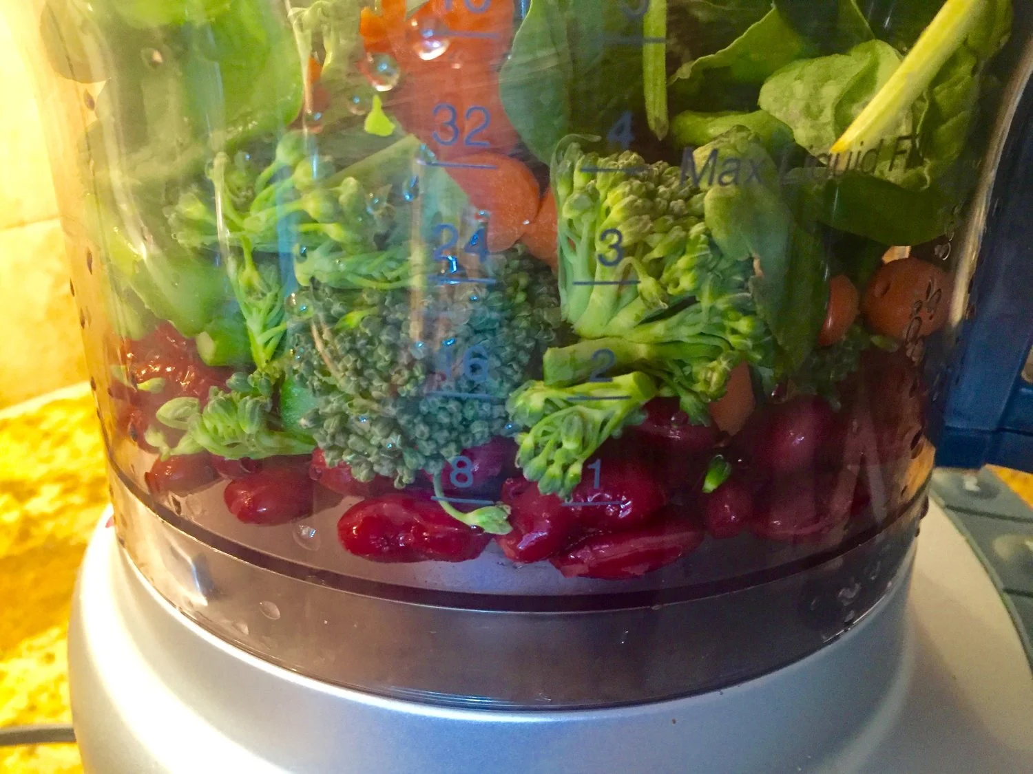 Add black beans to the vegetables in food processor and mix well.
