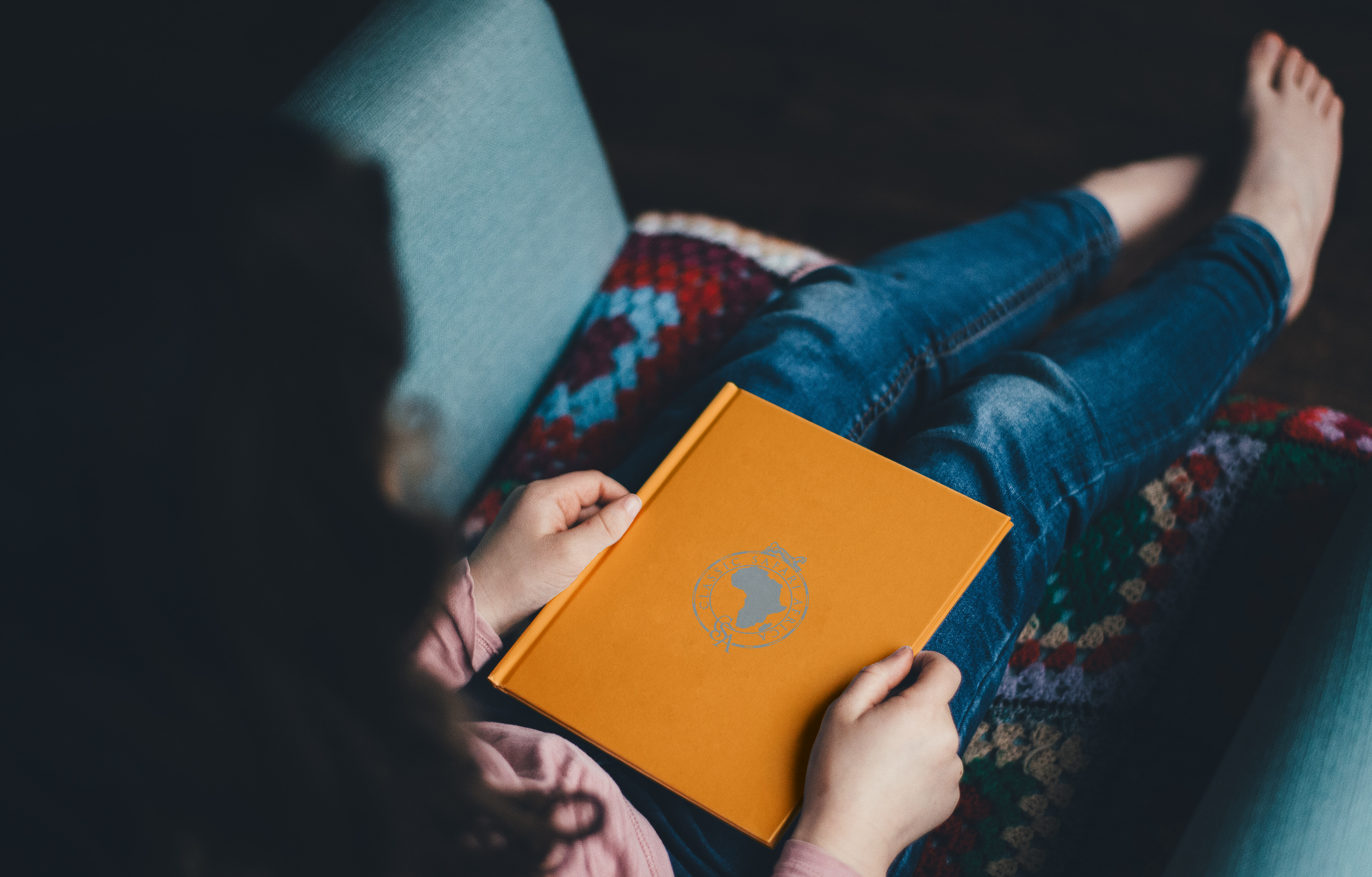 Woman Holding Hardcover Book Mockup.png