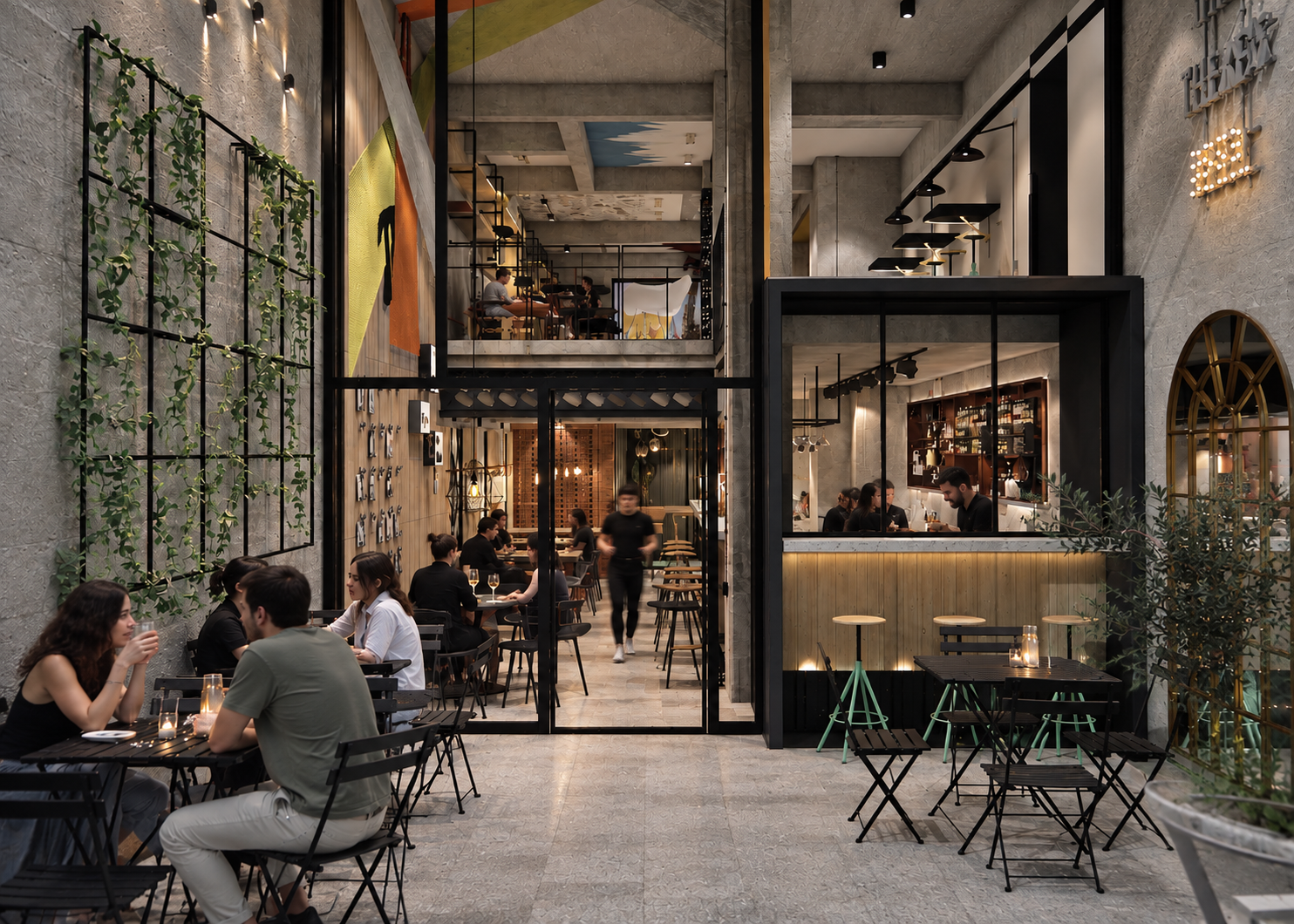 Interior of a modern, urban restaurant with multiple levels, exposed concrete walls, and large glass windows. Patrons are dining at tables, and there is a bar area with seated guests. The space features industrial decor with greenery, artwork, and warm lighting.