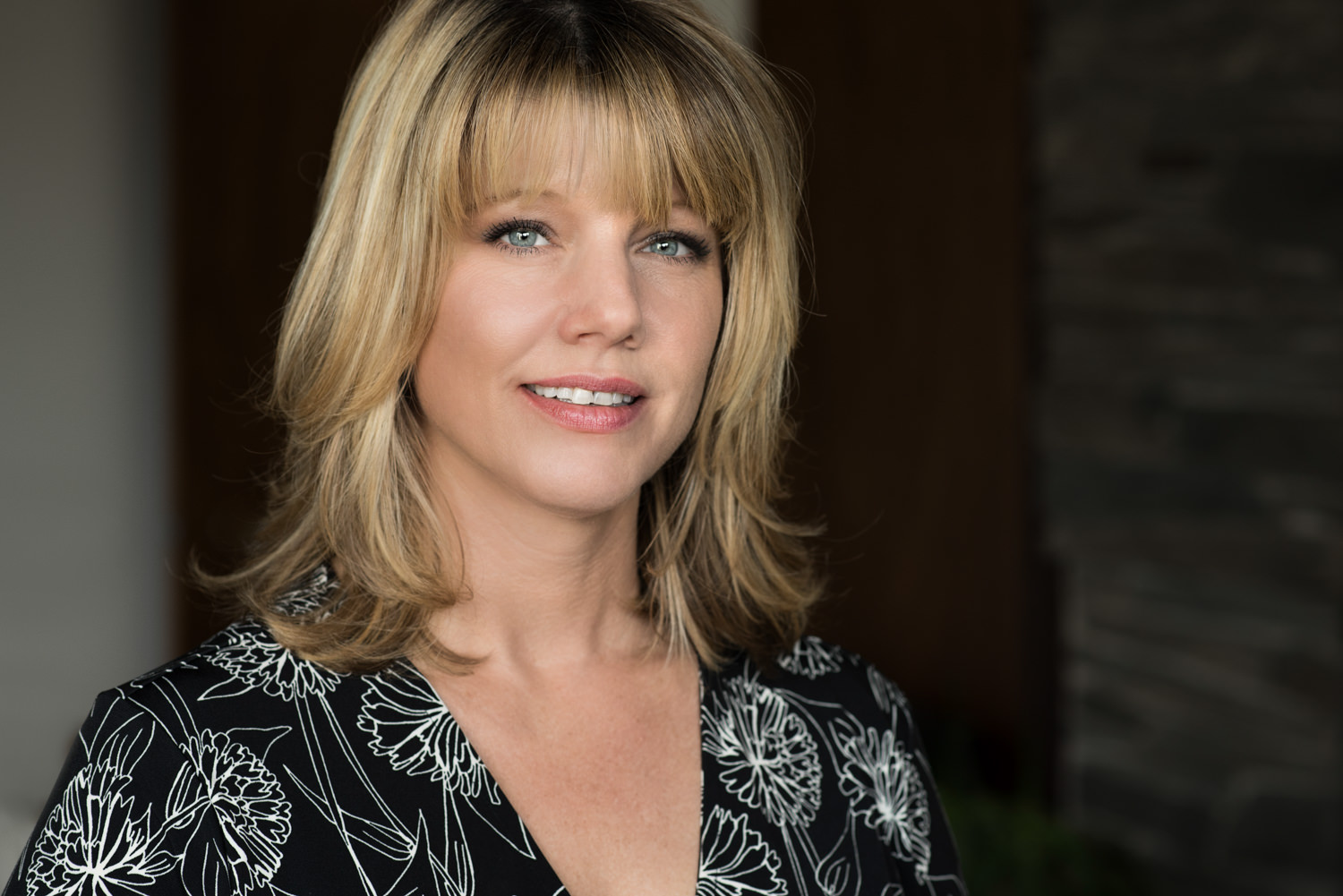 headshot blonde woman with bangs