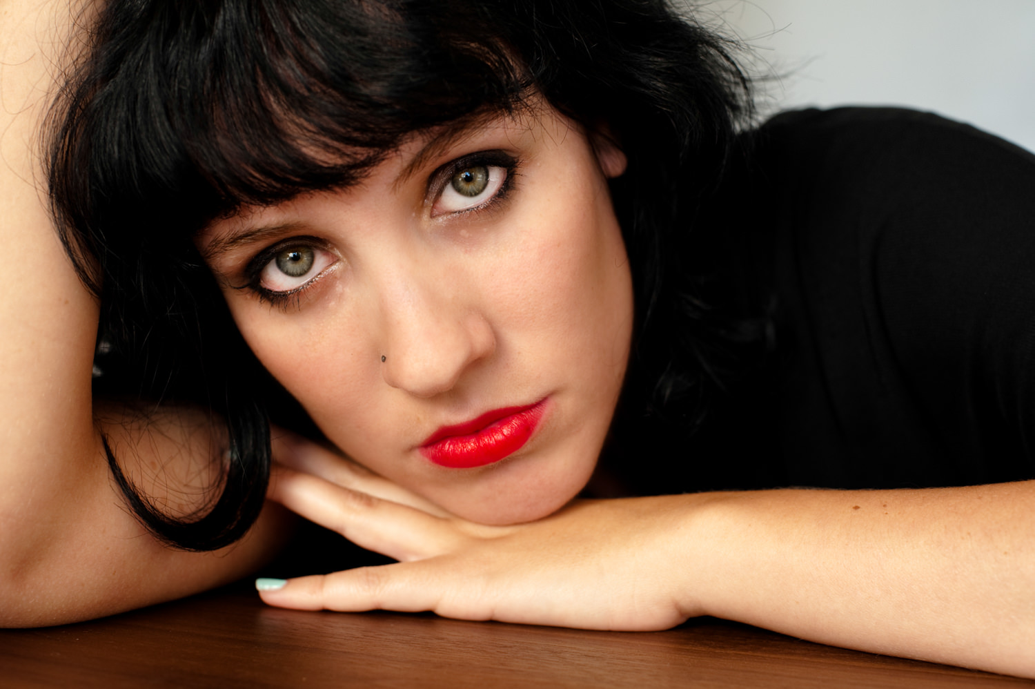 headshot brunette woman pouty red lips