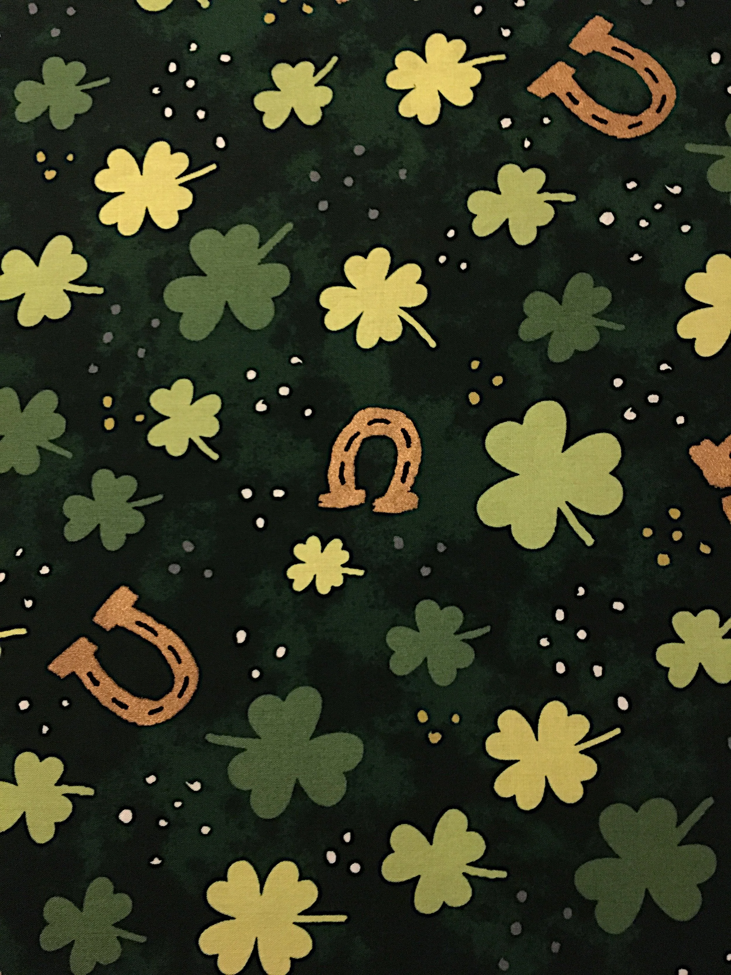 Shamrocks with gold horseshoes