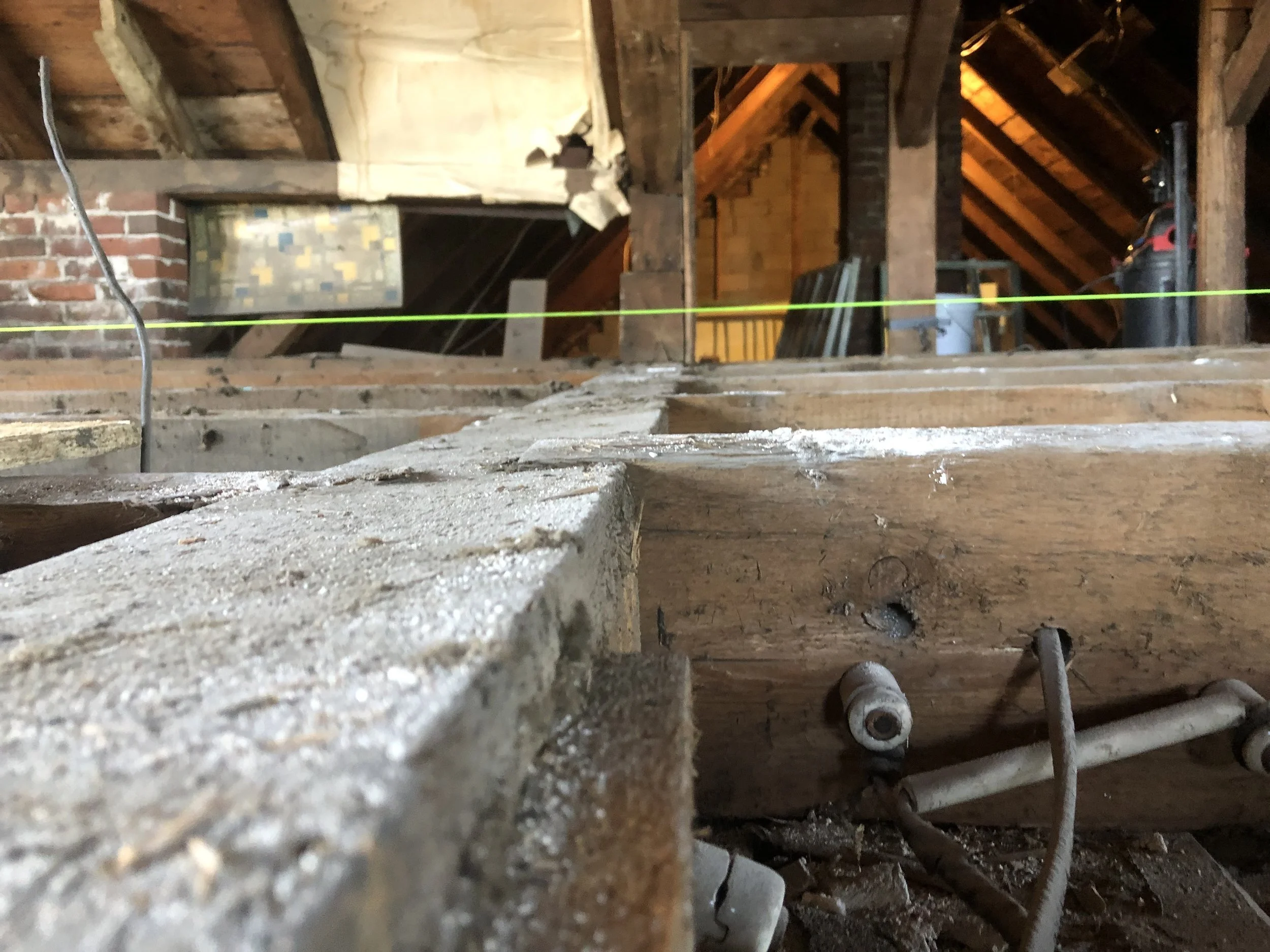 The green string is level… And yes, that’s every HGTV show’s nightmare - knob and tube!
