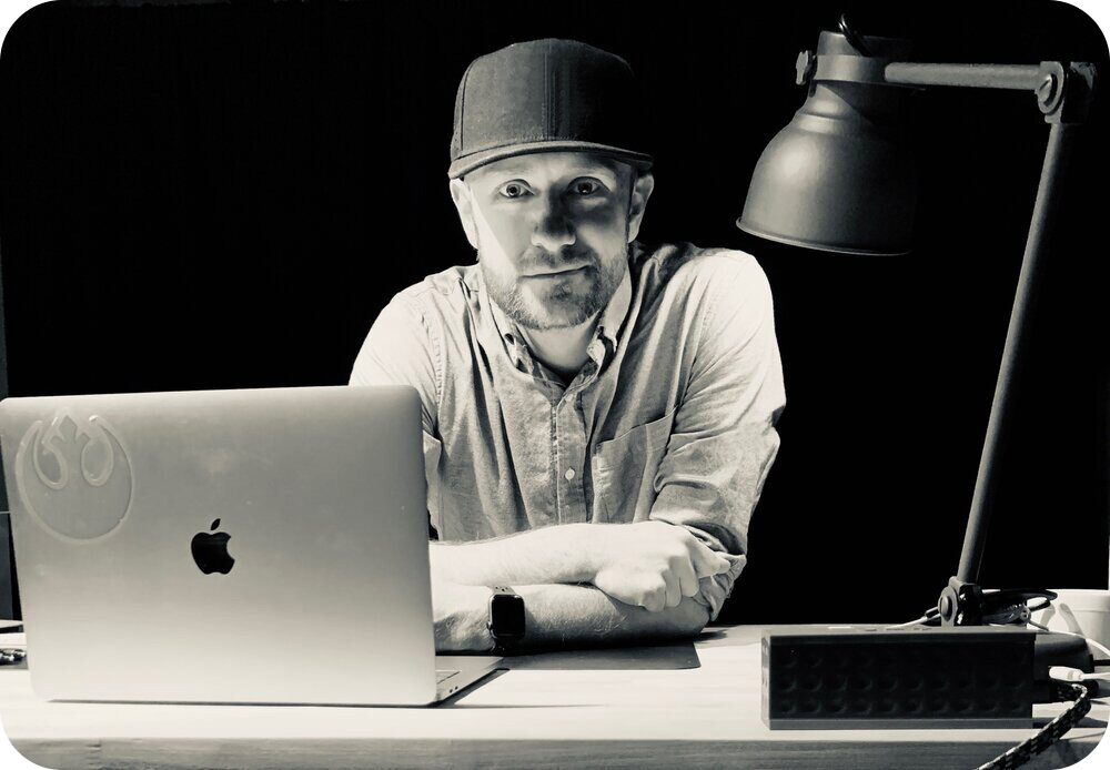 Derek at his desk