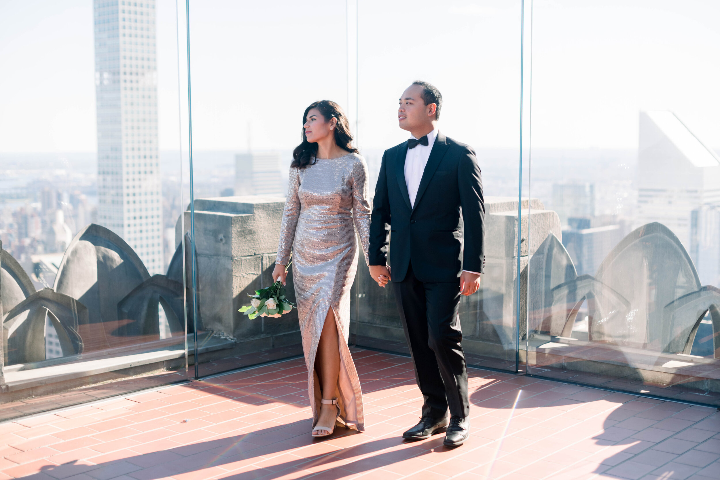 top of the rock+engagement+nyc engagement+NYC elopement+sparkly wedding gown+gold wedding gown+white bouquet+modern wedding