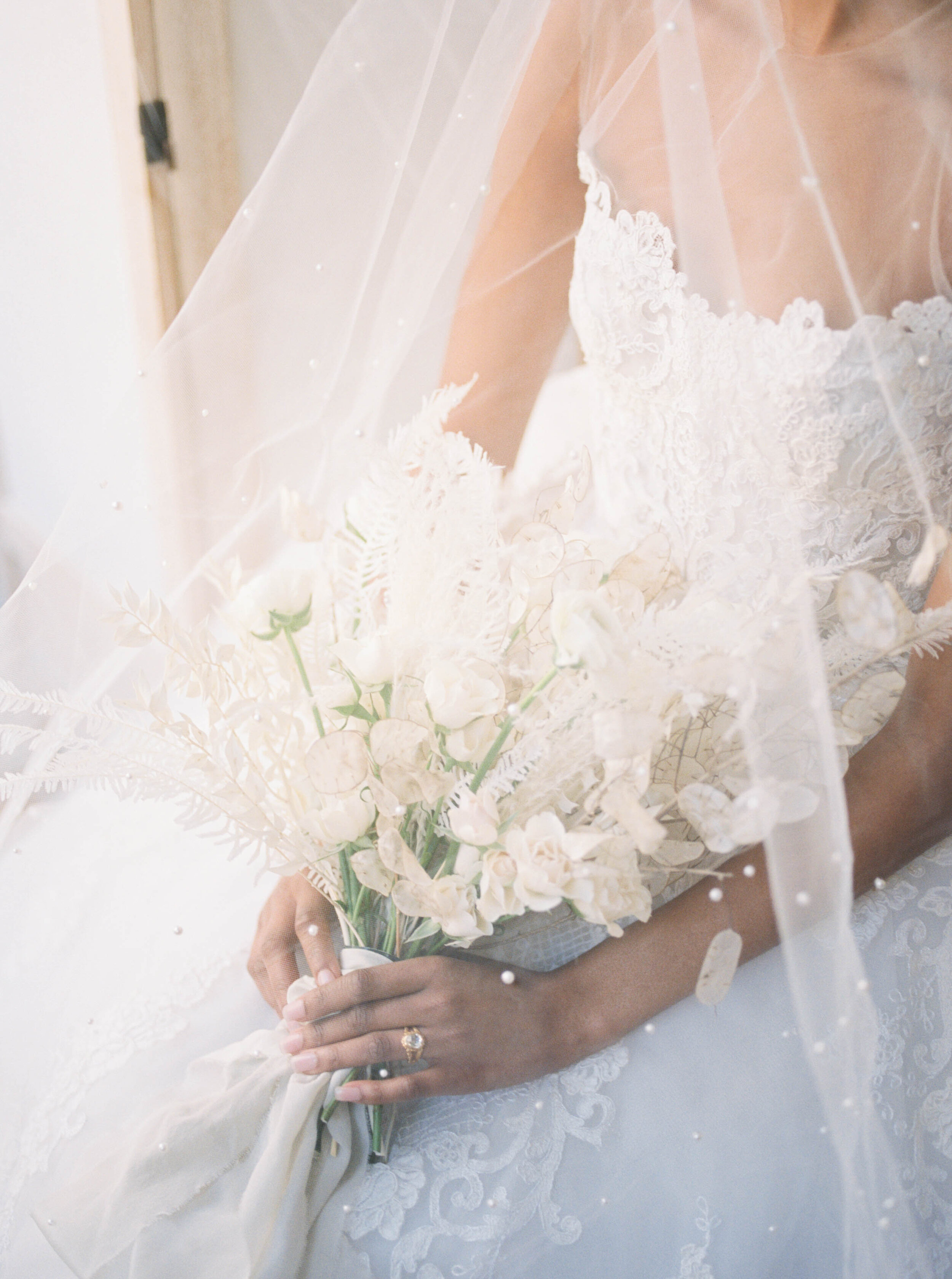 New York City Bridal Editorial featuring Reem Acra wedding gown and monochrome white bouquet by Liz Andolina