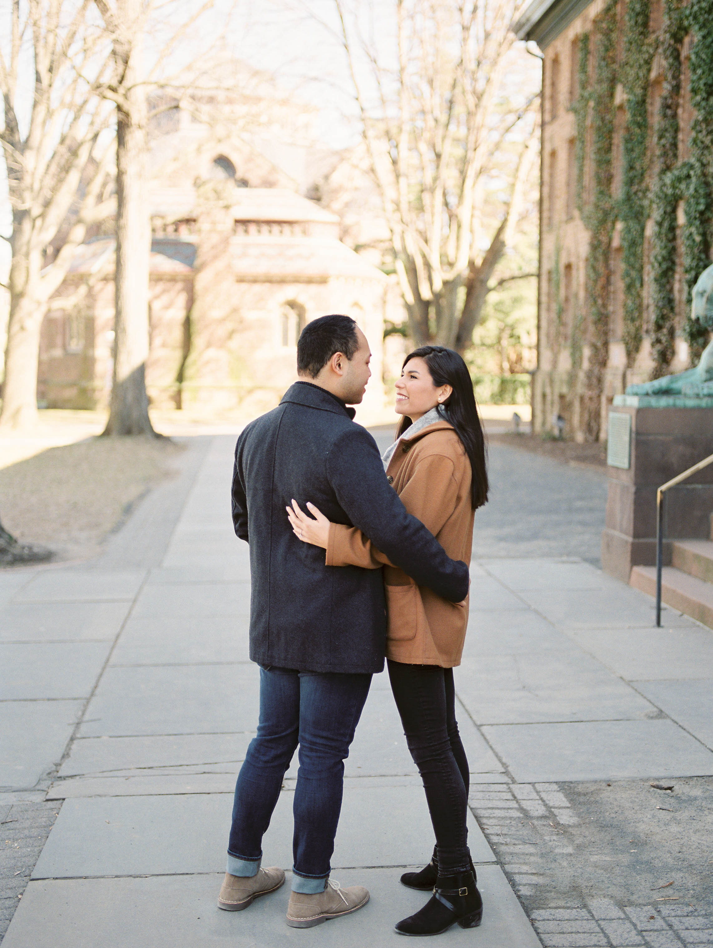 Outdoor lifestyle couples session with beige coat, sunglasses, coffee, shopping in Princeton New Jersey on Princeton University Campus by Liz Andolina Photography