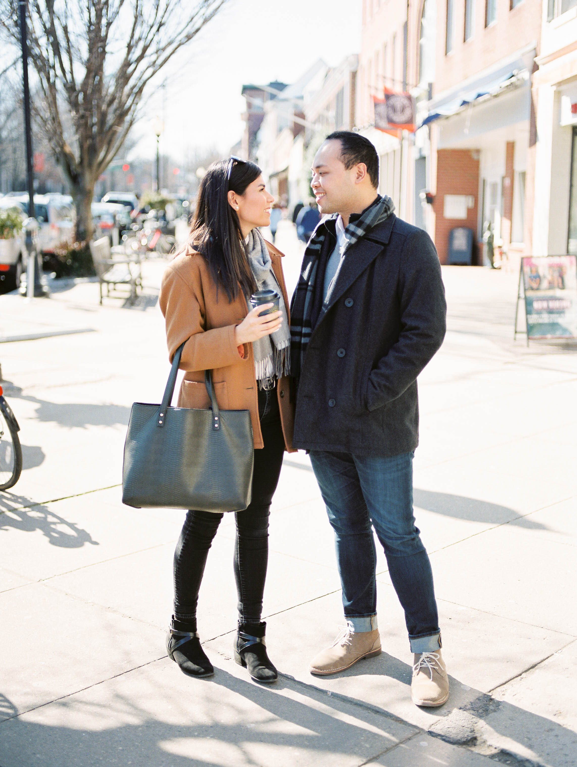 Outdoor lifestyle couples session with beige coat, sunglasses, coffee, shopping in Princeton New Jersey on Princeton University Campus by Liz Andolina Photography