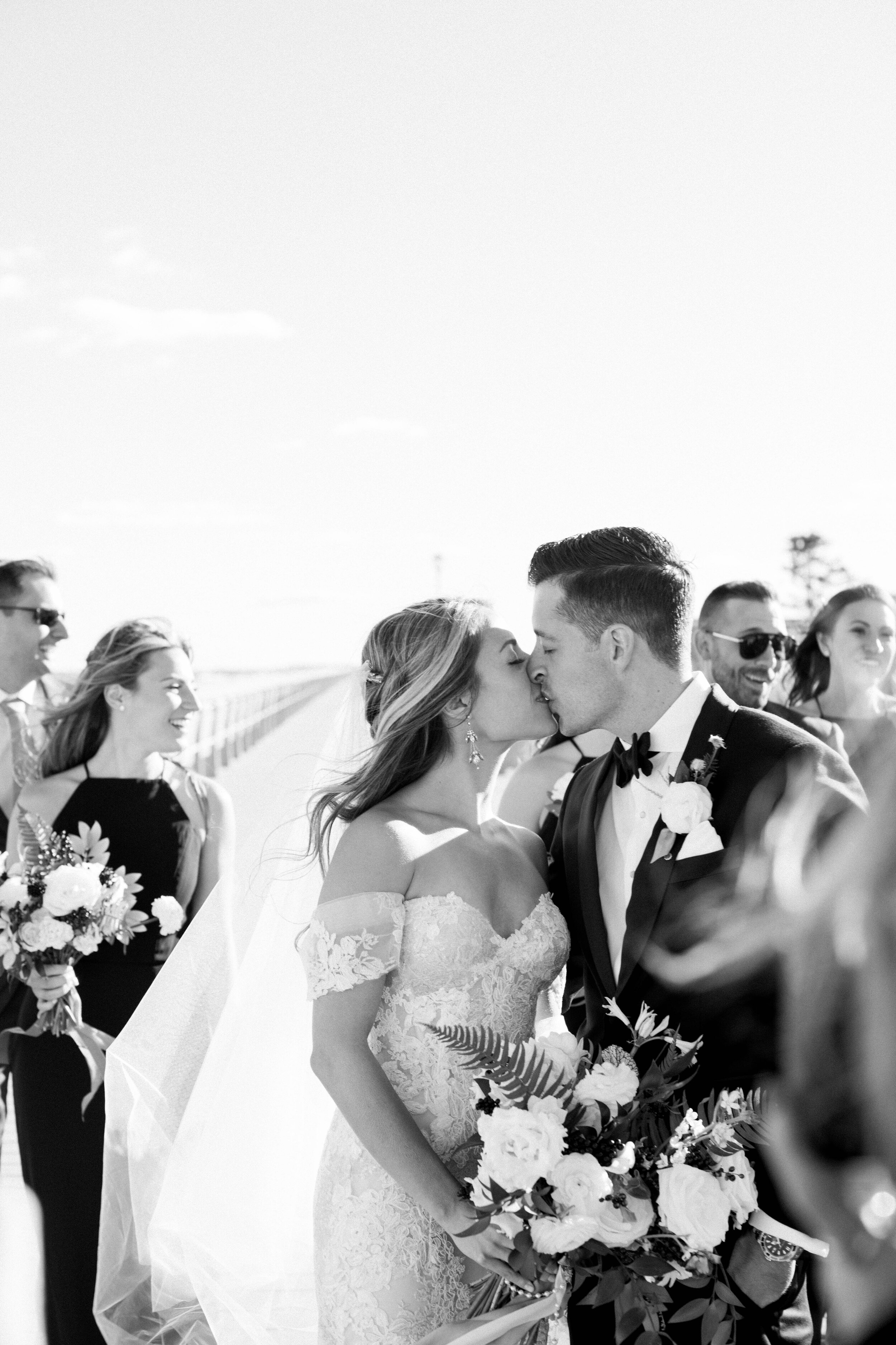 Elegant and glamorous wedding with Monique Lhuillier gown, white organic florals, and sunset portraits at Bay Head Yacht Club in Bay Head, New Jersey by Liz Andolina Photography