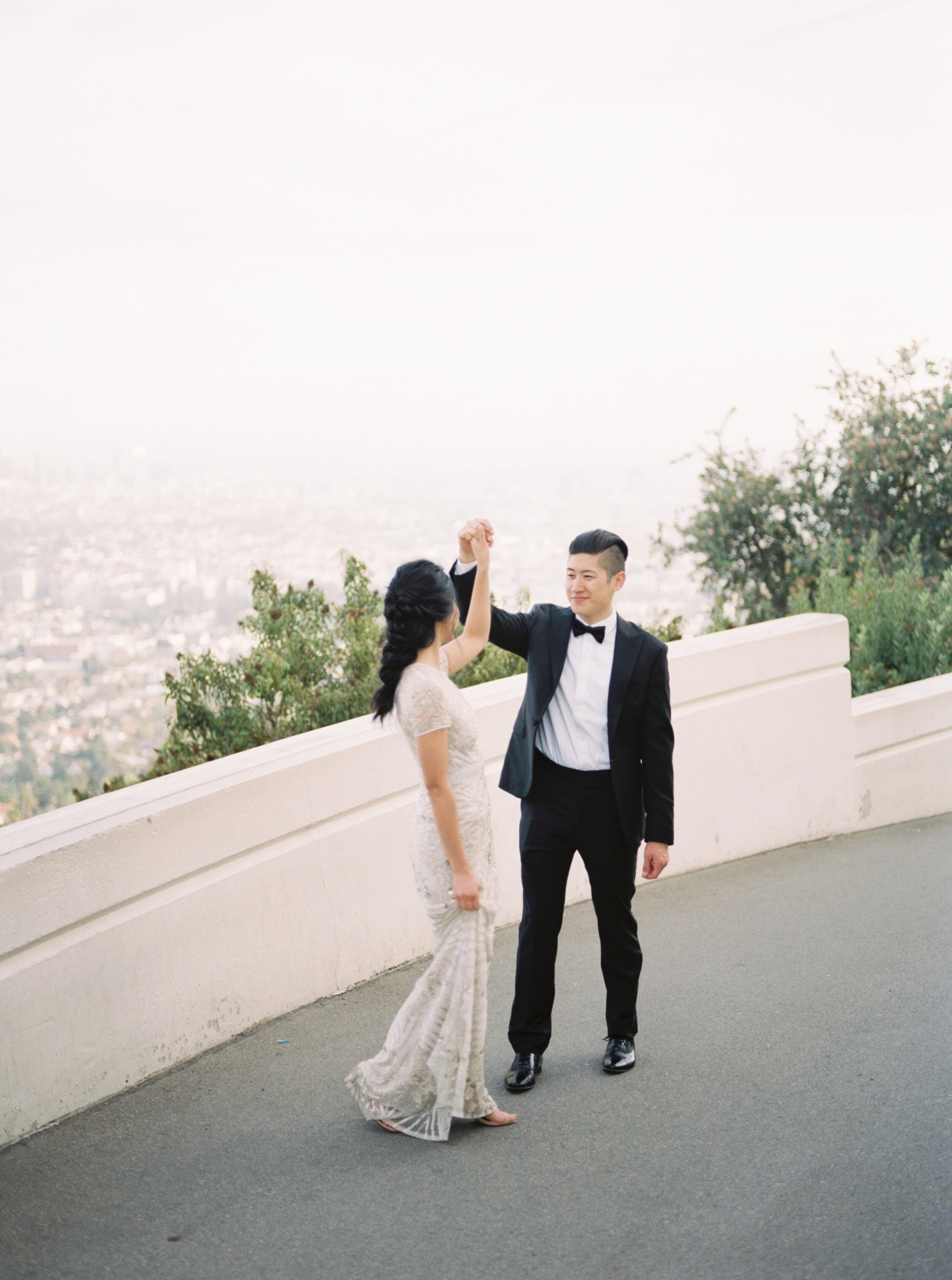 Elegant and romantic old Hollywood wedding with beaded Naeem Khan wedding gown, white organic florals, and epic sunset views at Griffith Observatory in Los Angeles by Liz Andolina Photography