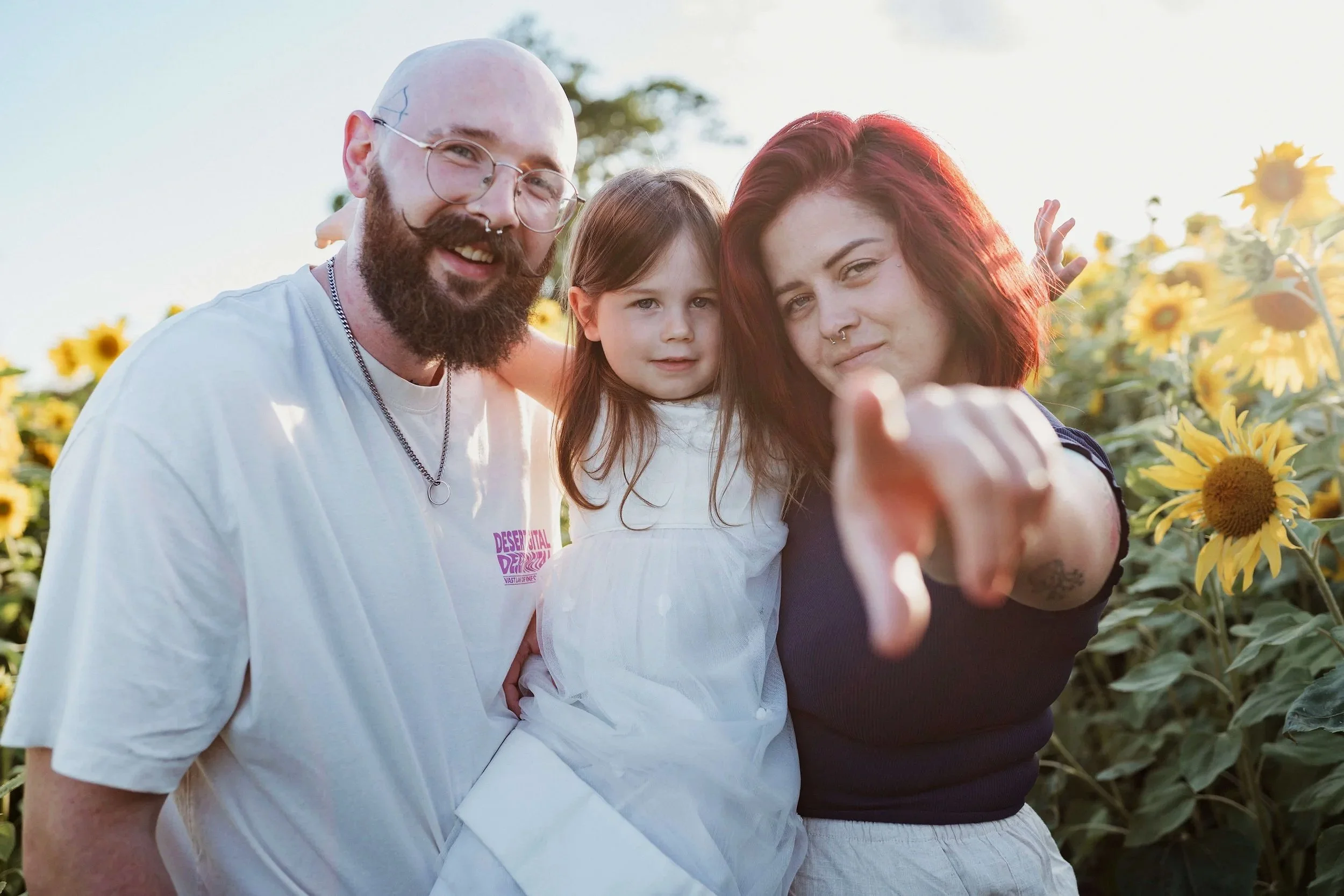 family in sunflower field photo