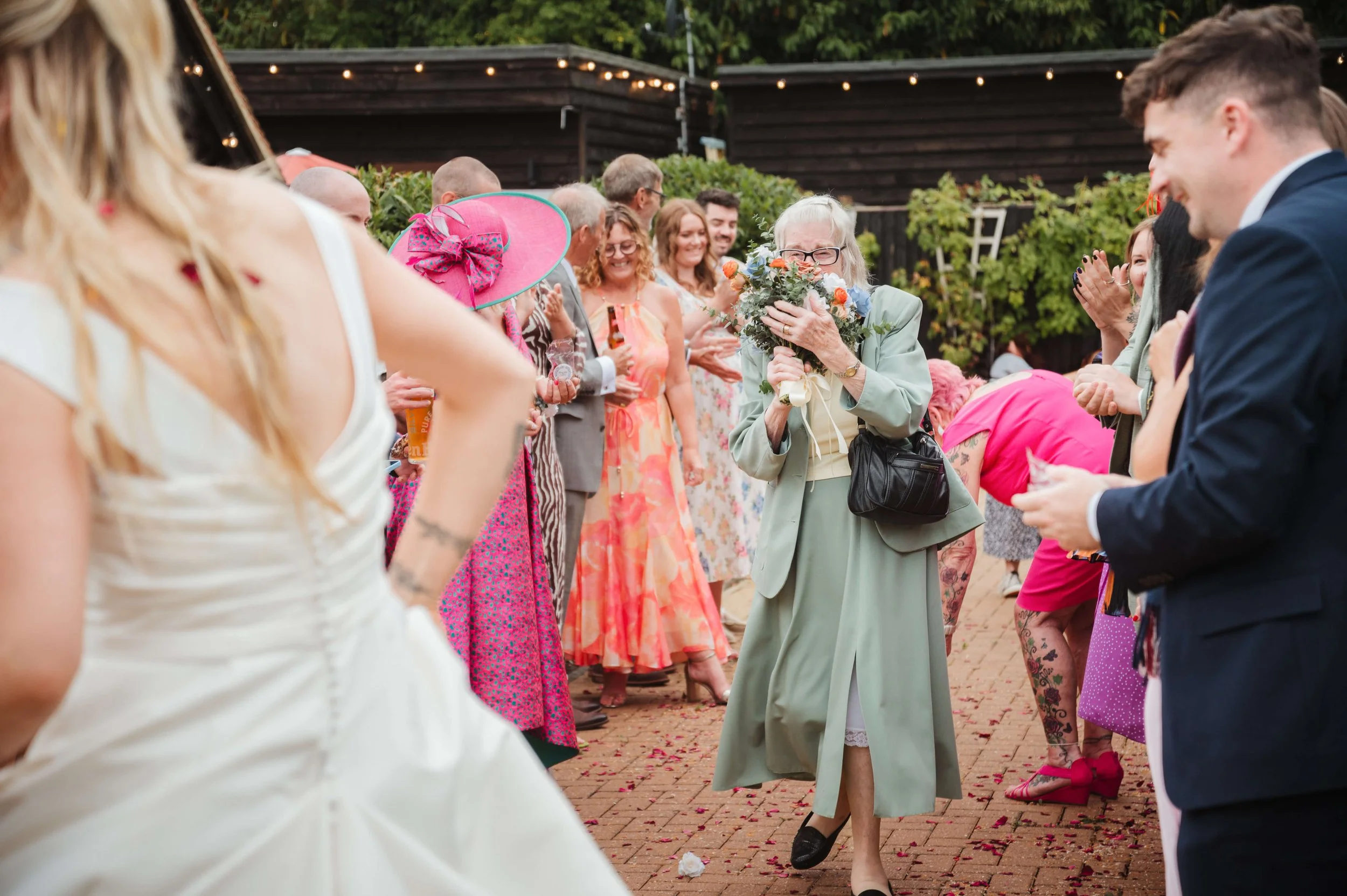 face of joy as she catches the bouquet 