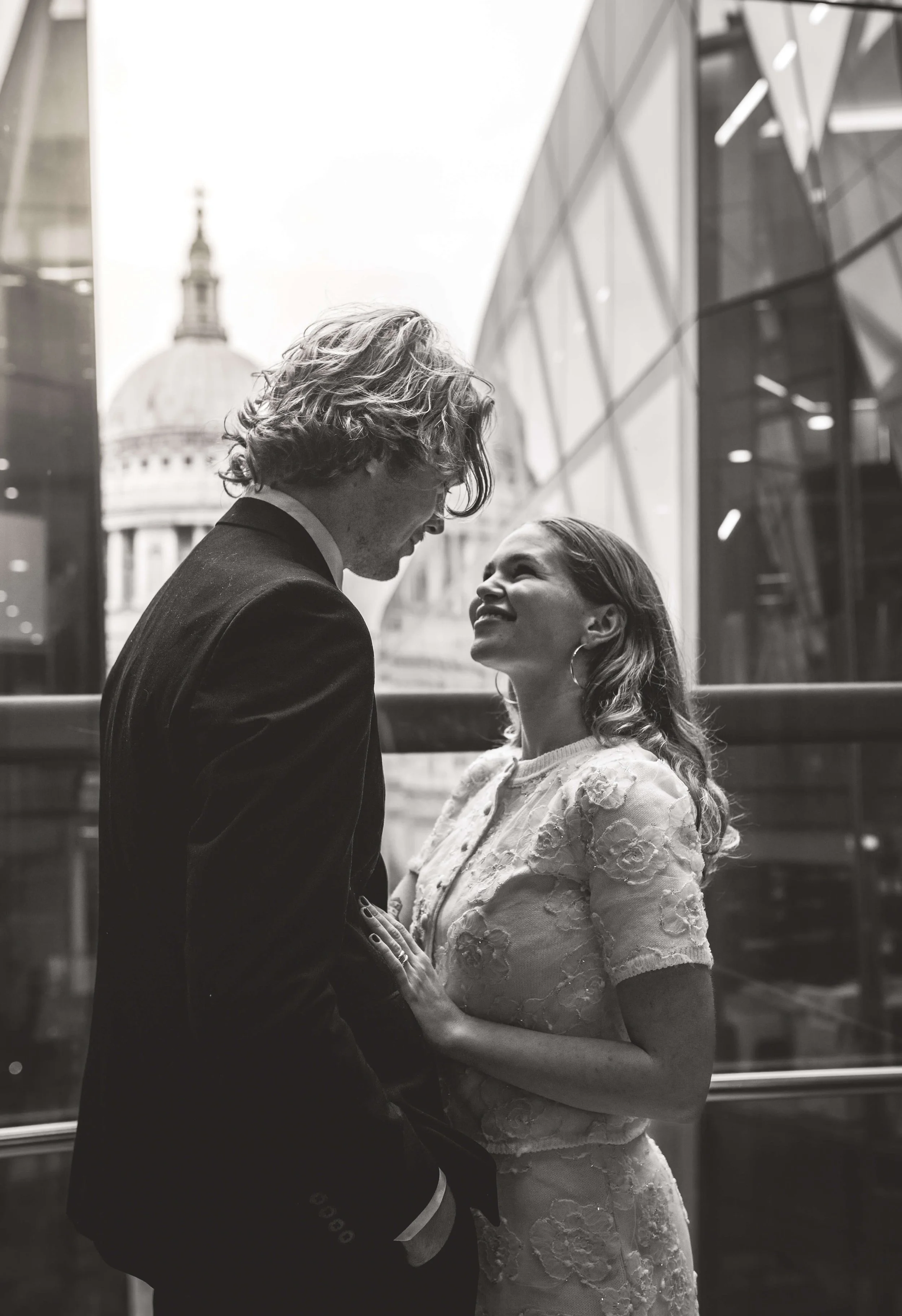 Bride and Groom stare into each others eyes in the lift of one new change London 