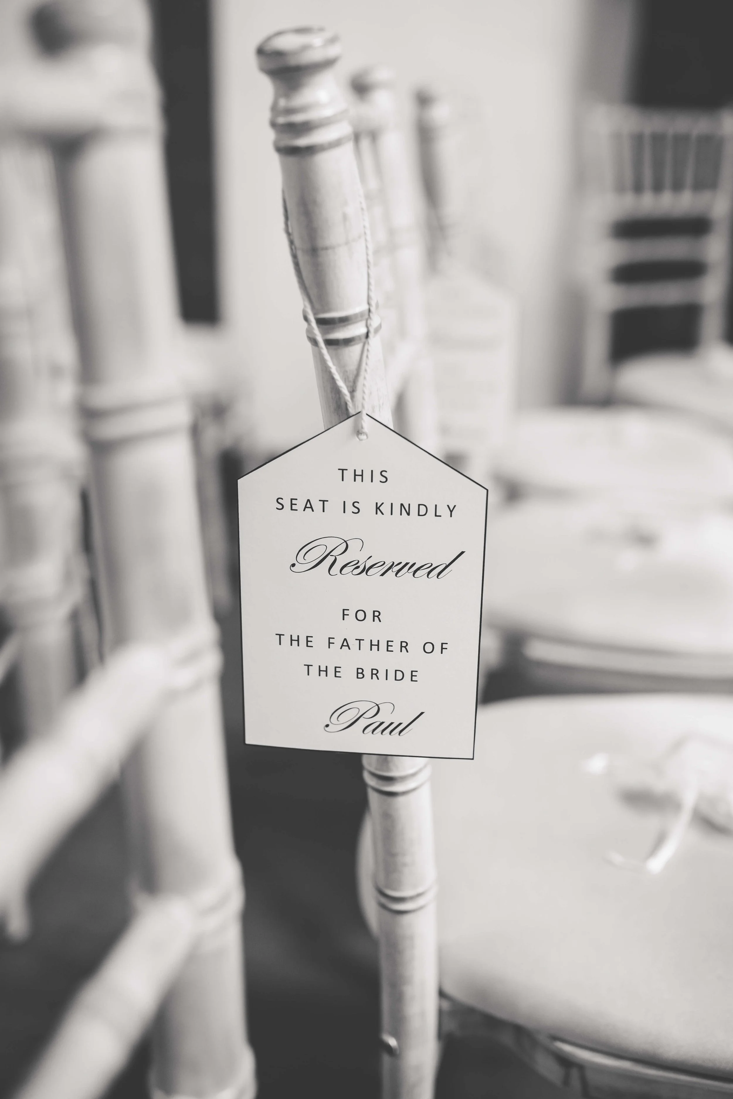 wedding chair with reserved sign for the father of the bride