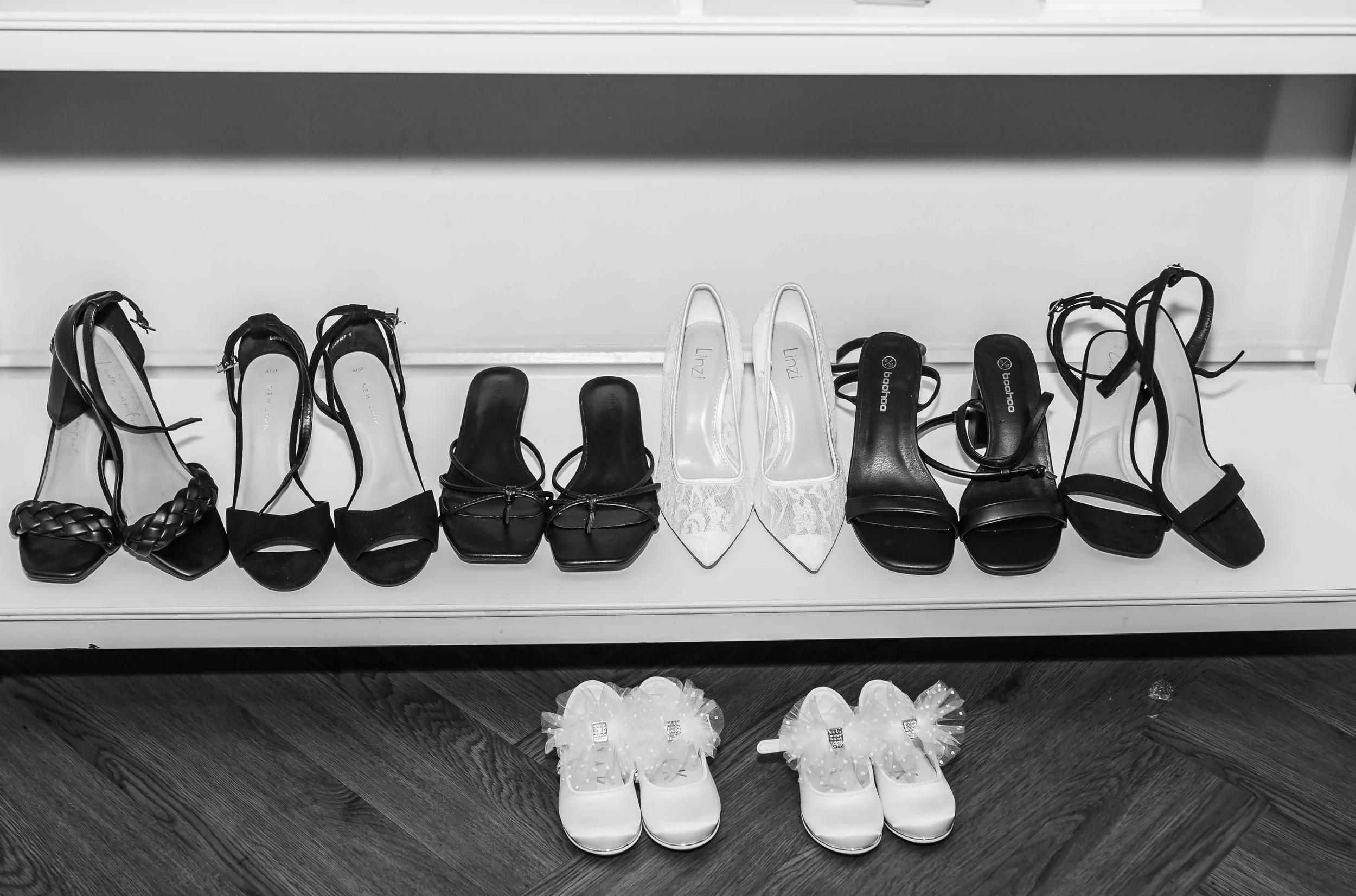 bridal black and white image of shoes of the bridal party