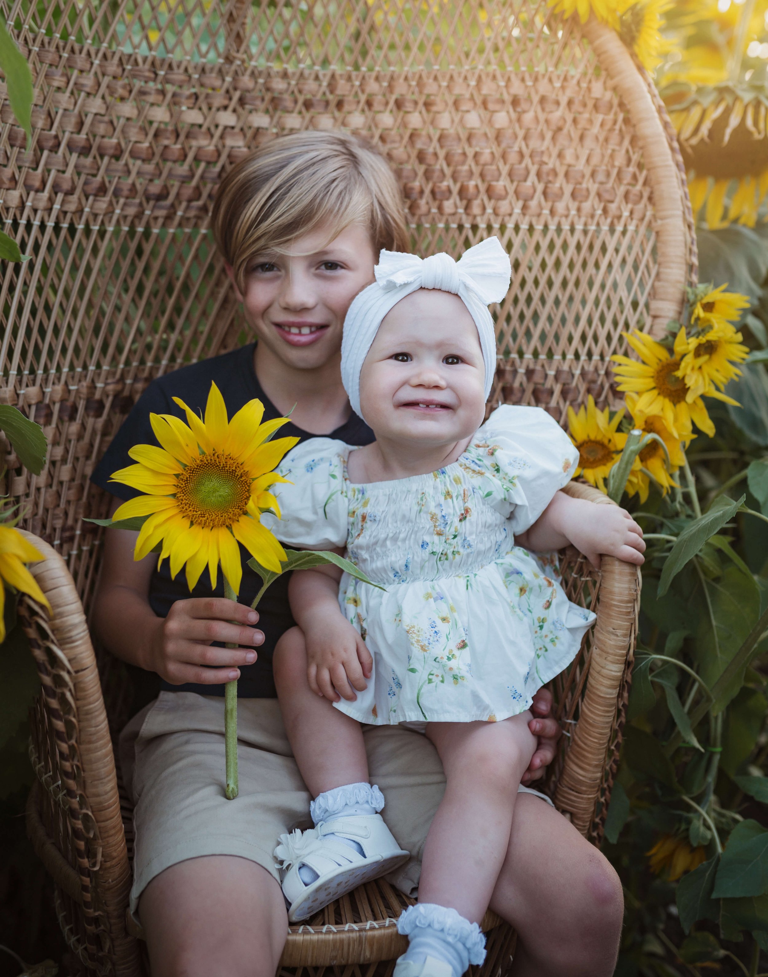 brother and sister with sunflower photo
