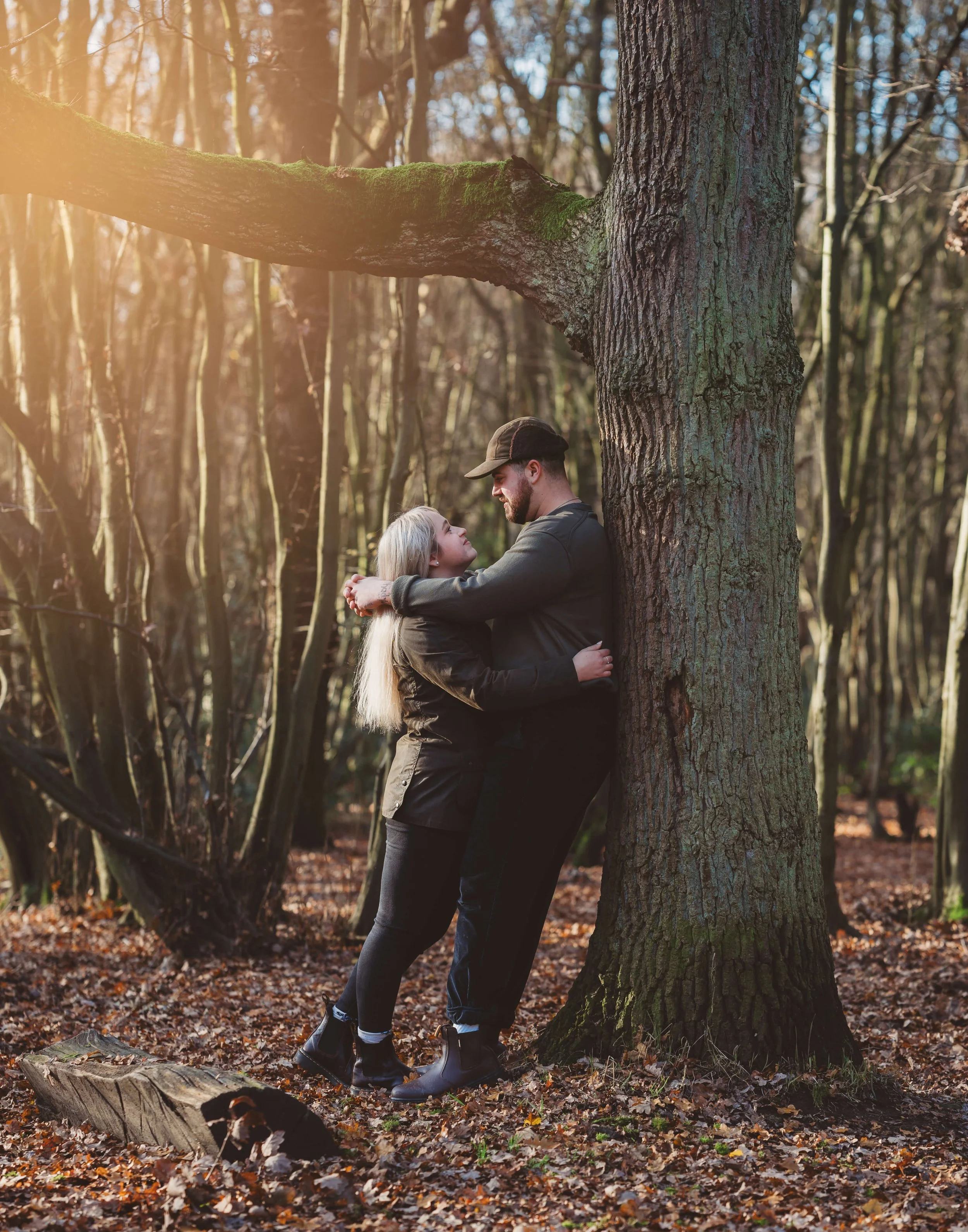 newly engaged couple in the woods