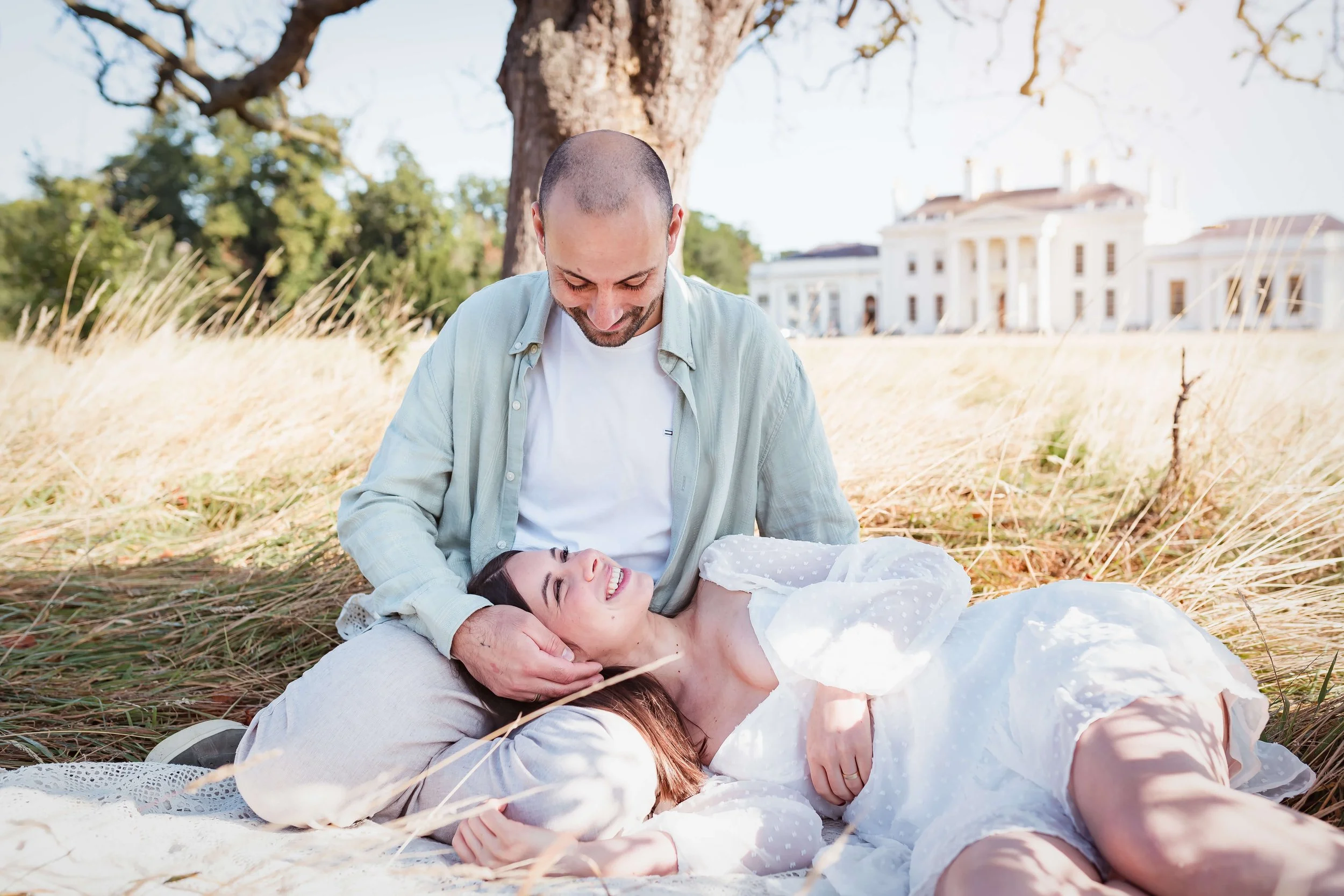 couple gaze into each others eyes at Hylands Hall in Essex 