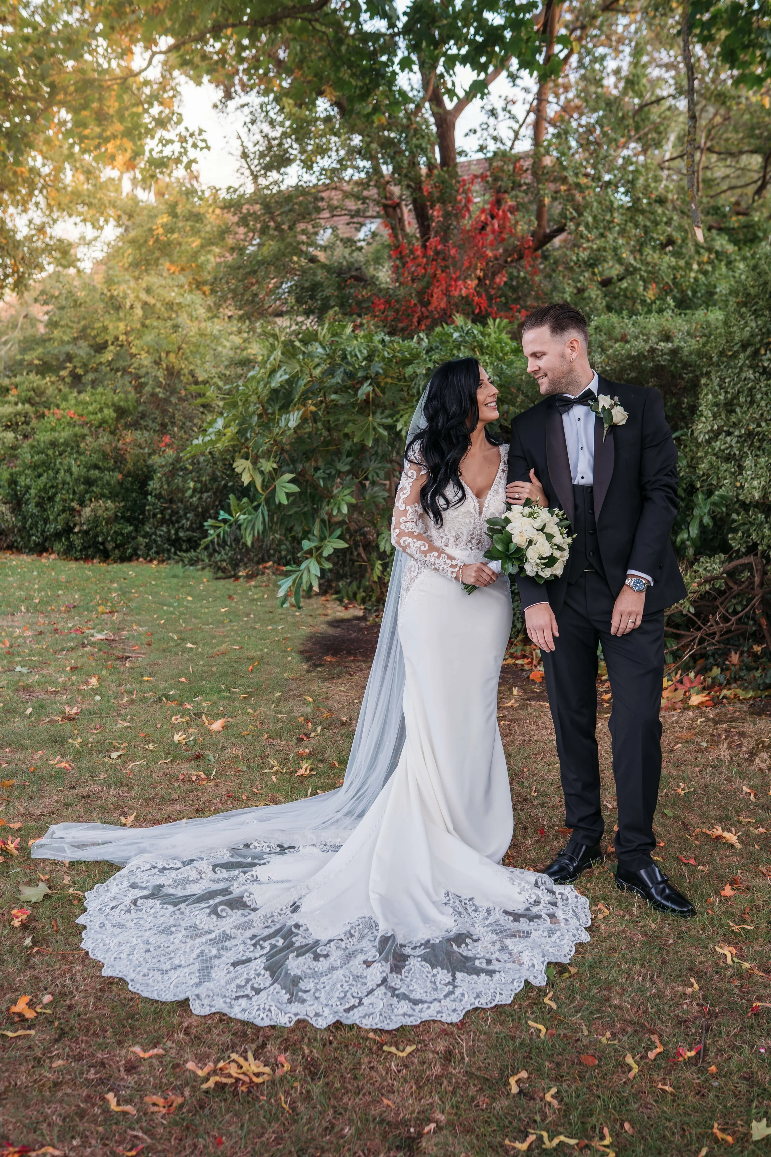 bride and groom looking lovingly into each others eyes in the grounds of the Rochford hotel in essex 