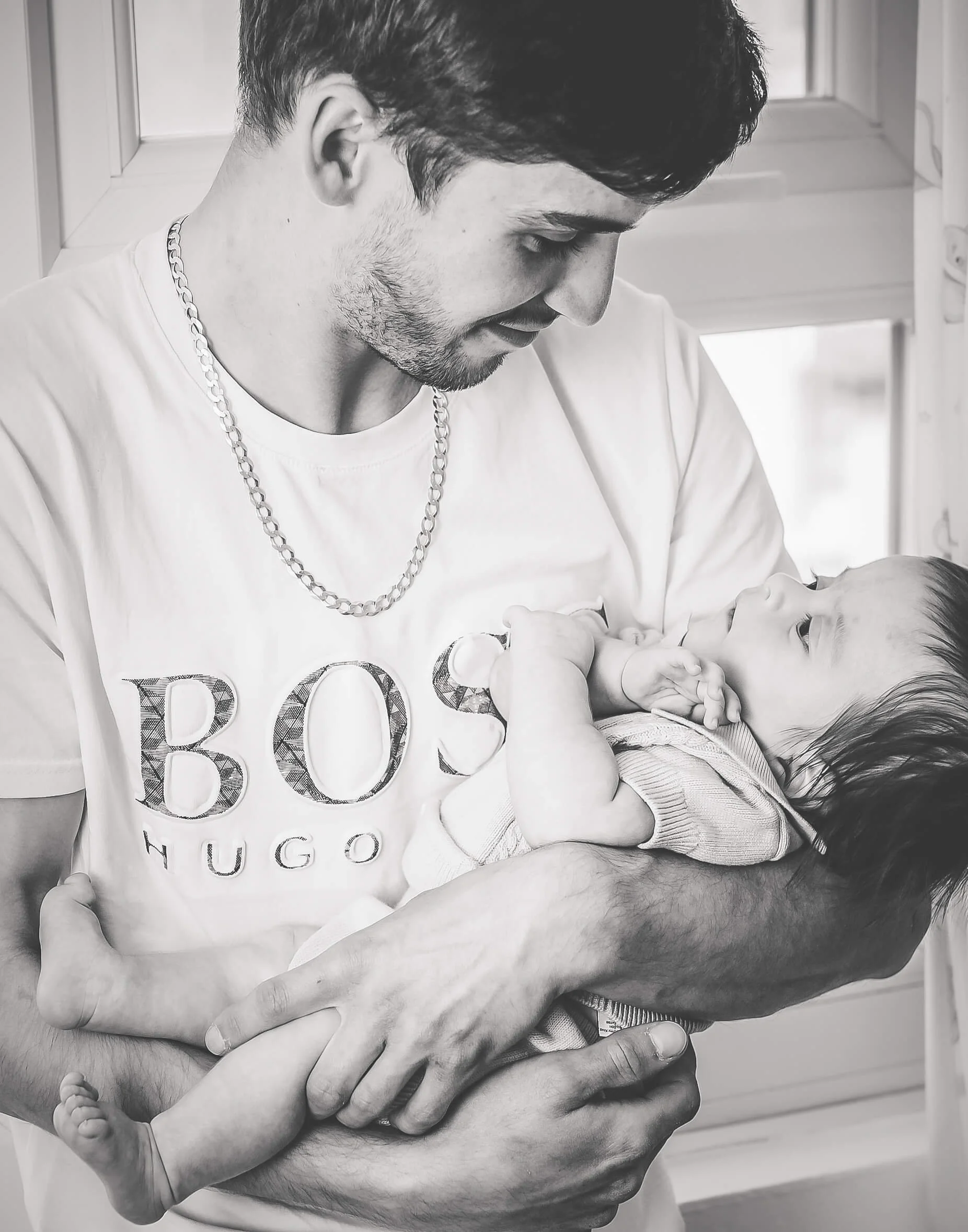 dad looking lovingly into the eyes of his baby 