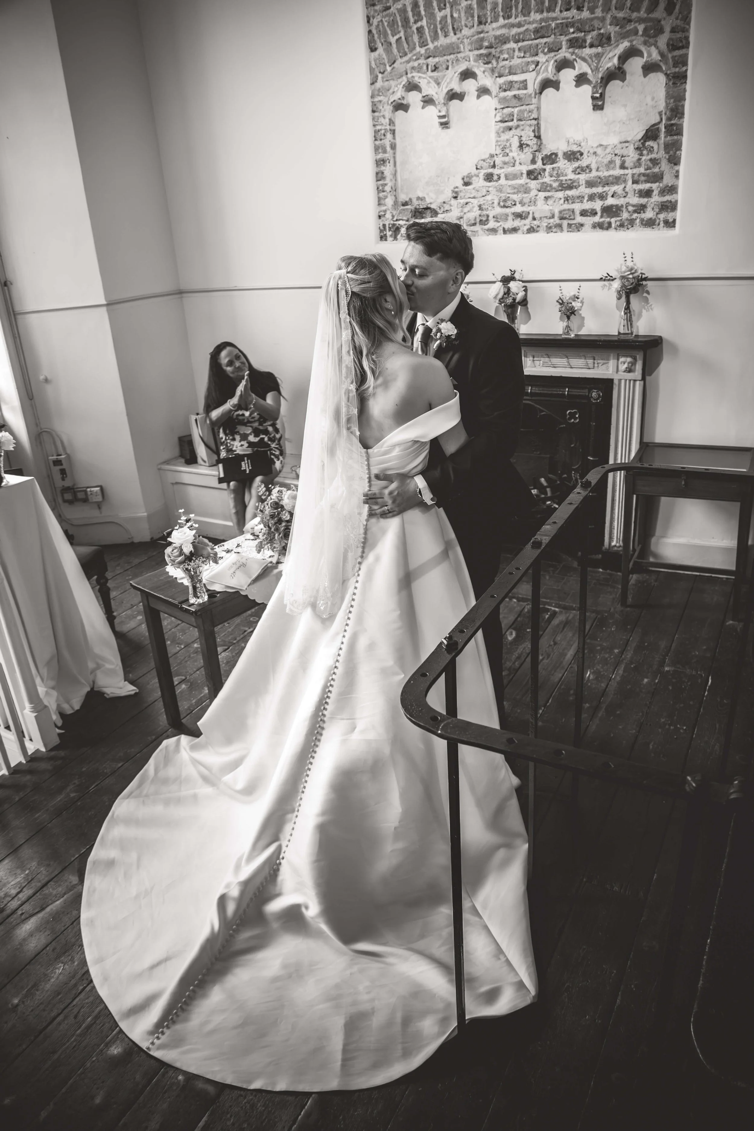 bride and groom kiss