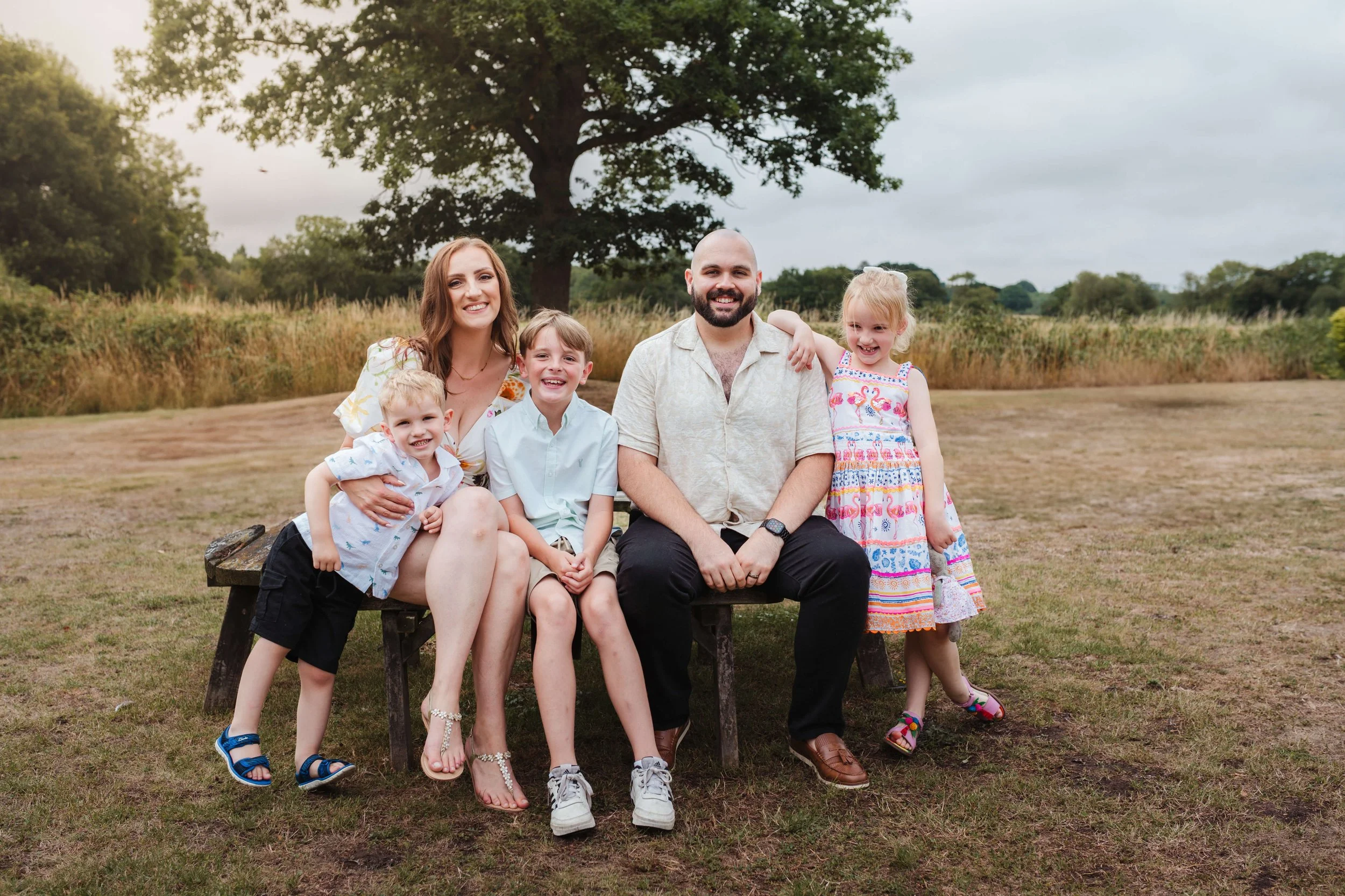 guests posing for photograph at wedding 