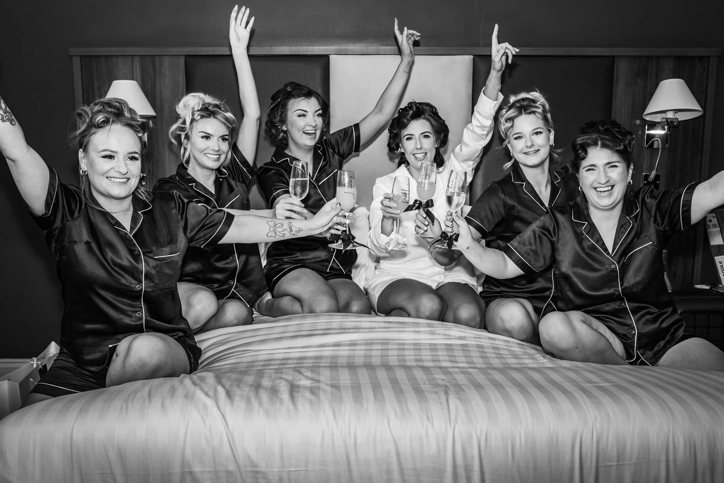 bridal party having fun together before getting ready