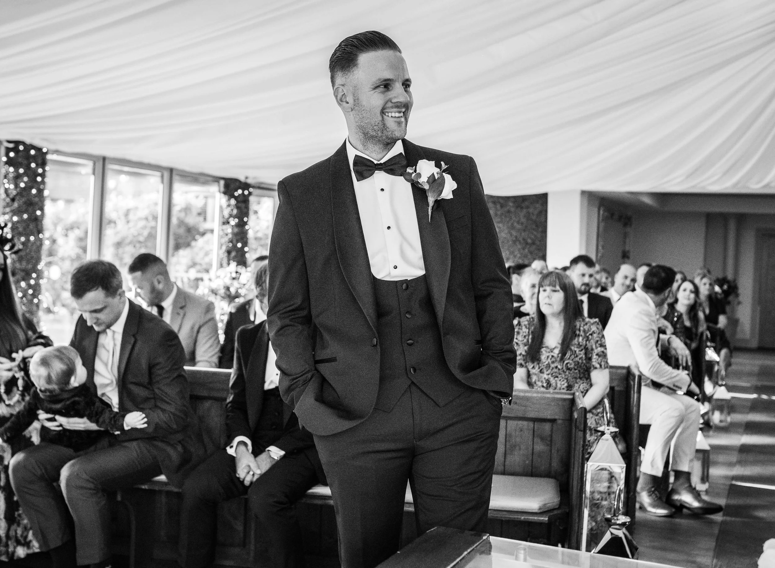 groom waiting for the bride to walk down the aisle 