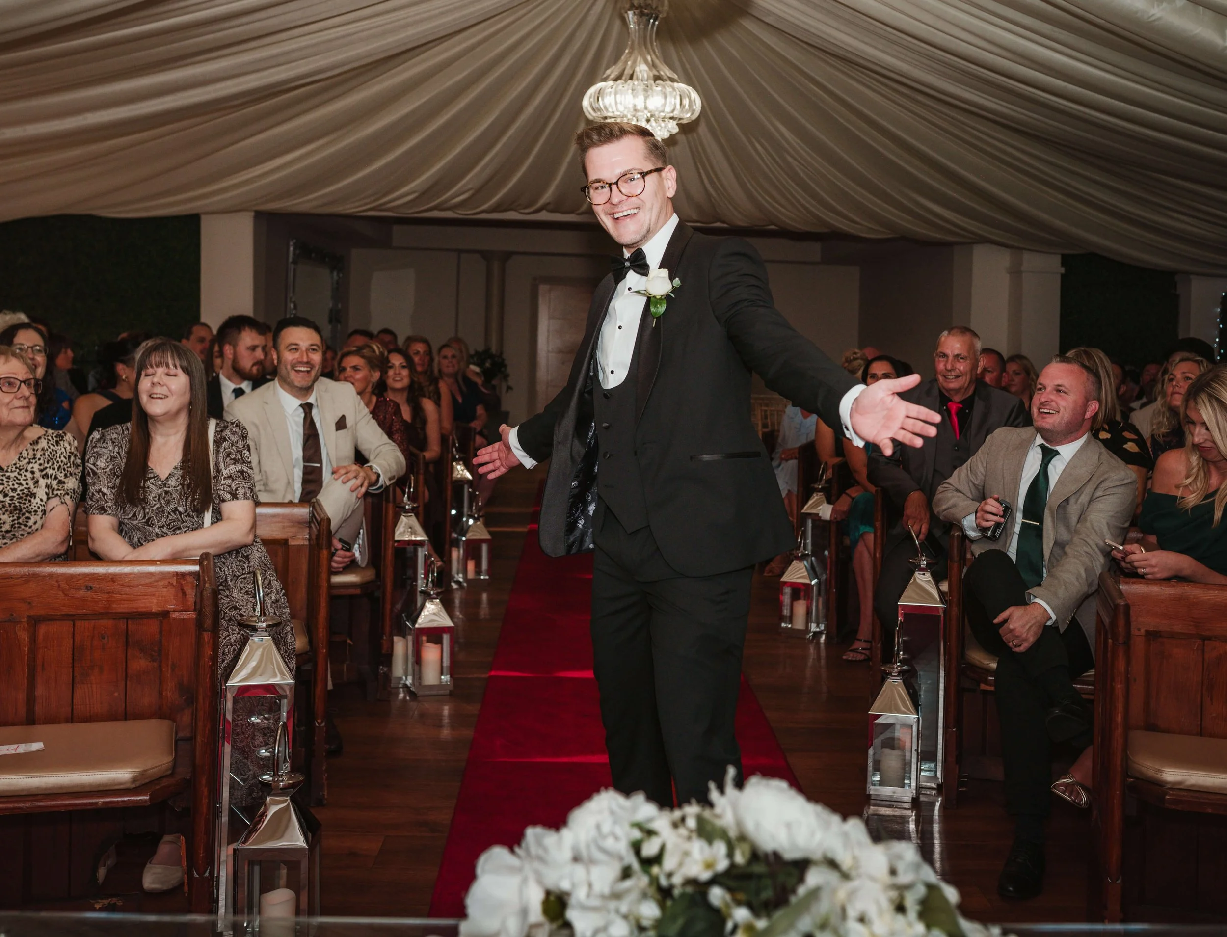 best man dancing in aisle