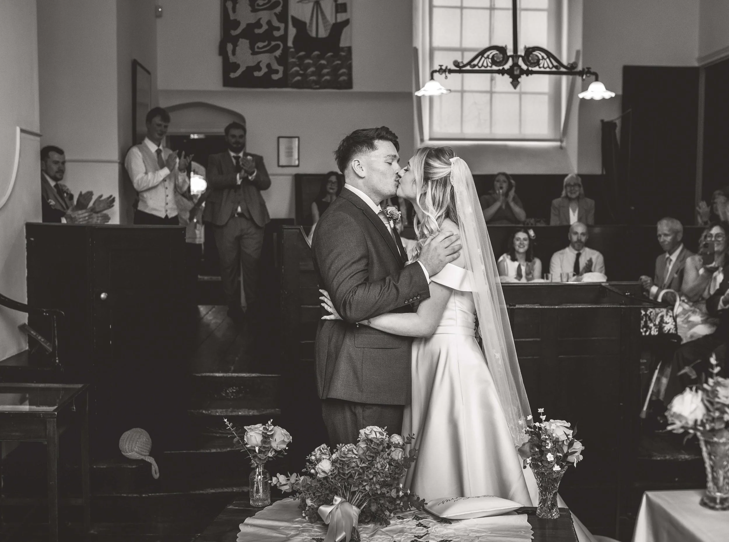 bride and groom share their first kiss as husband and wife 