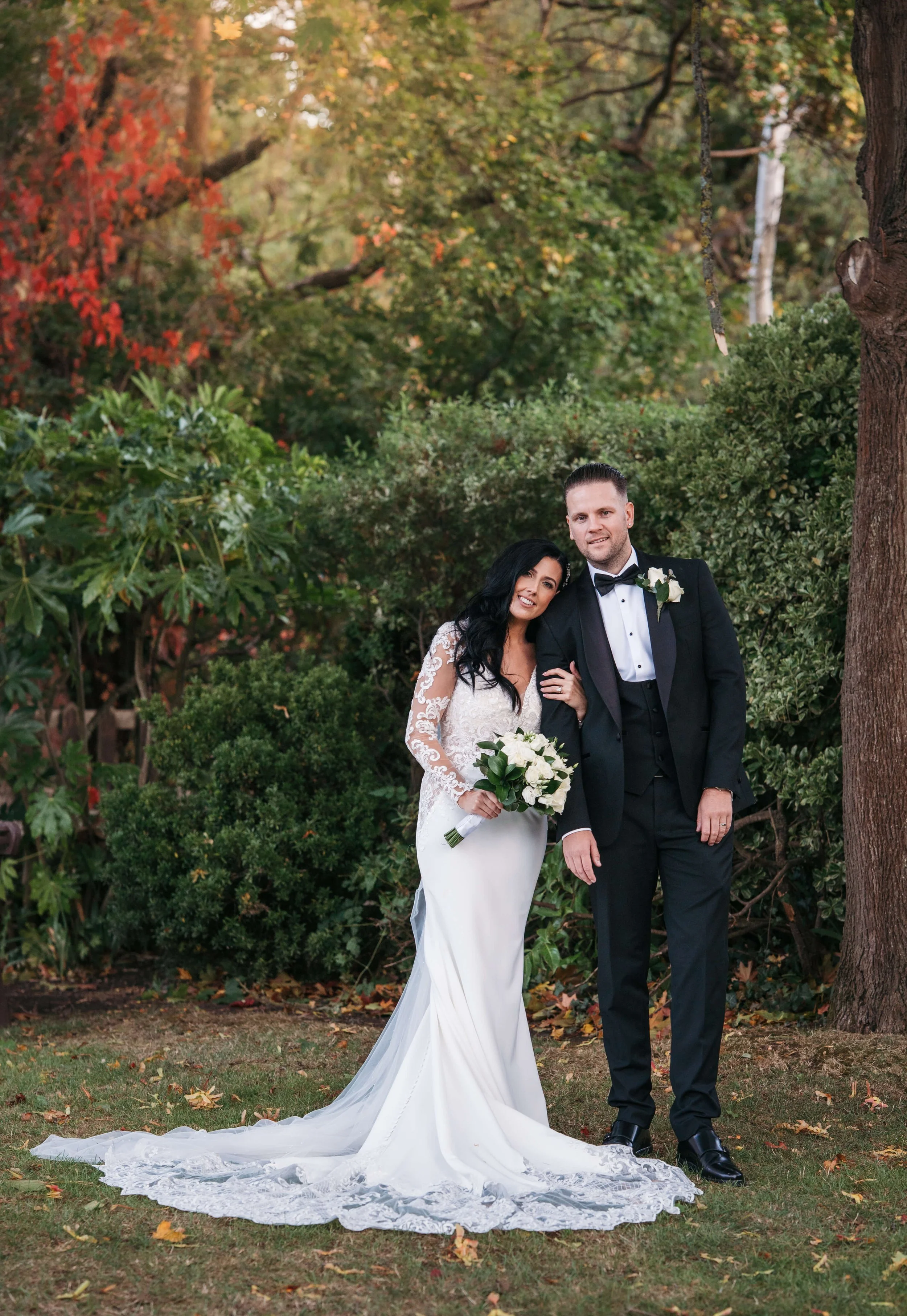 bride and groom couple shot with autumnal background 