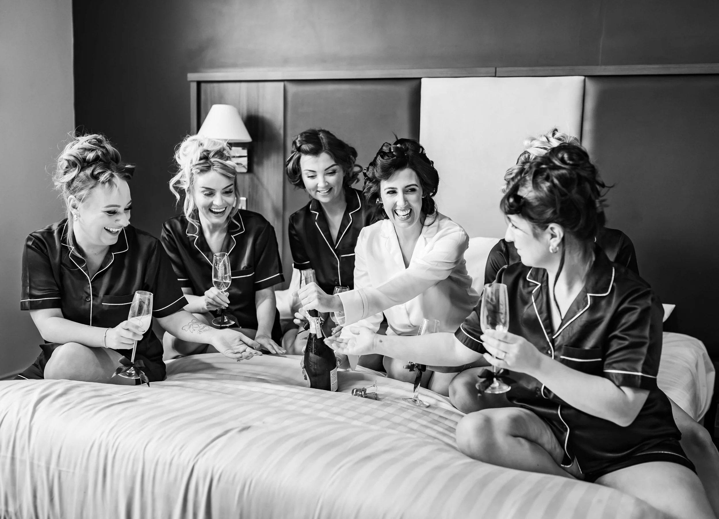 bridal party toasting the bride 