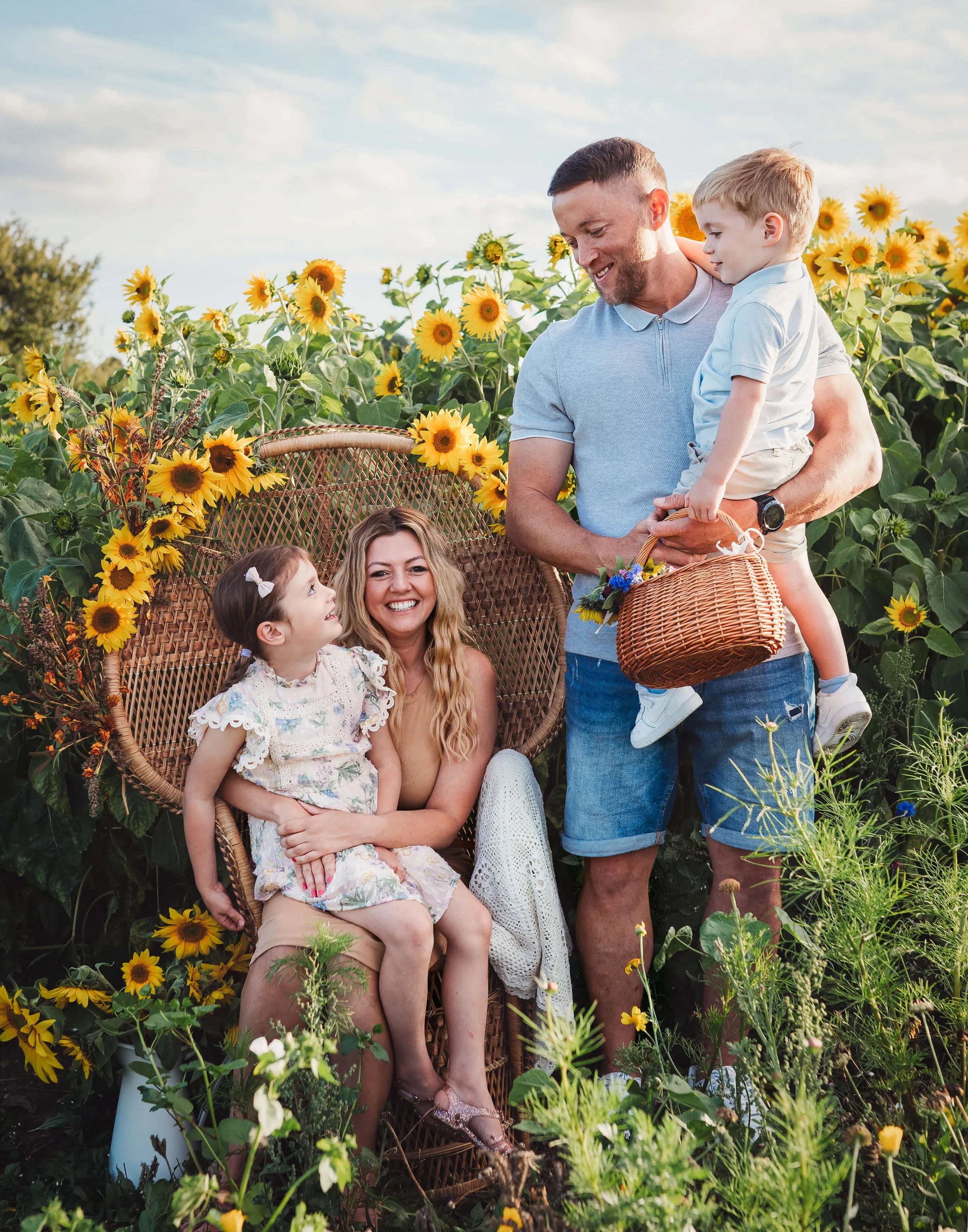 family photo session in sunflower field 
