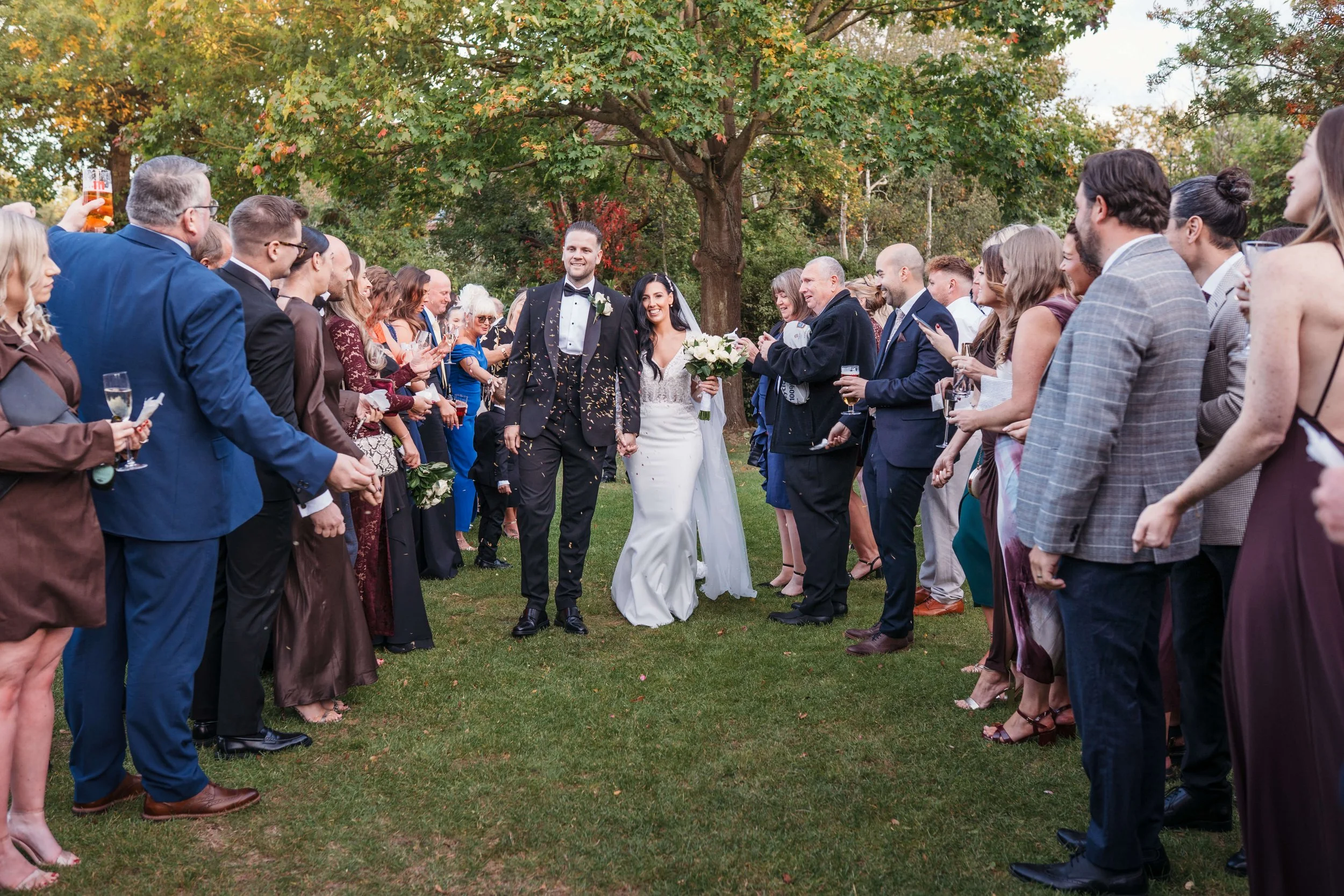 confetti throw with bride and groom and family