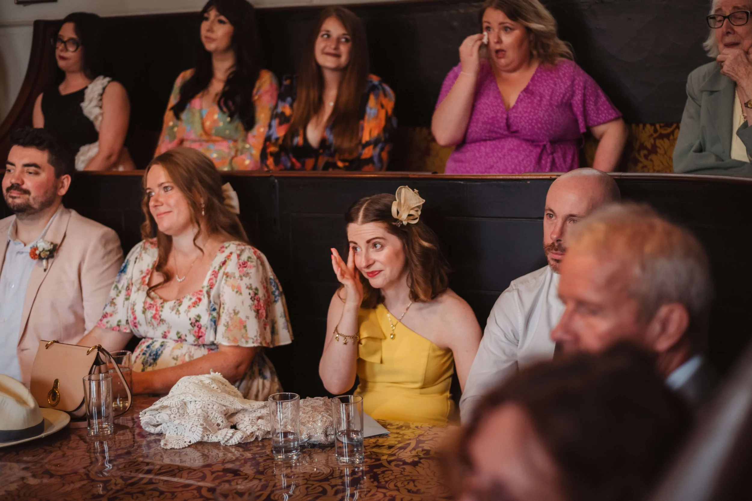 wedding guest wipes an emotional tear