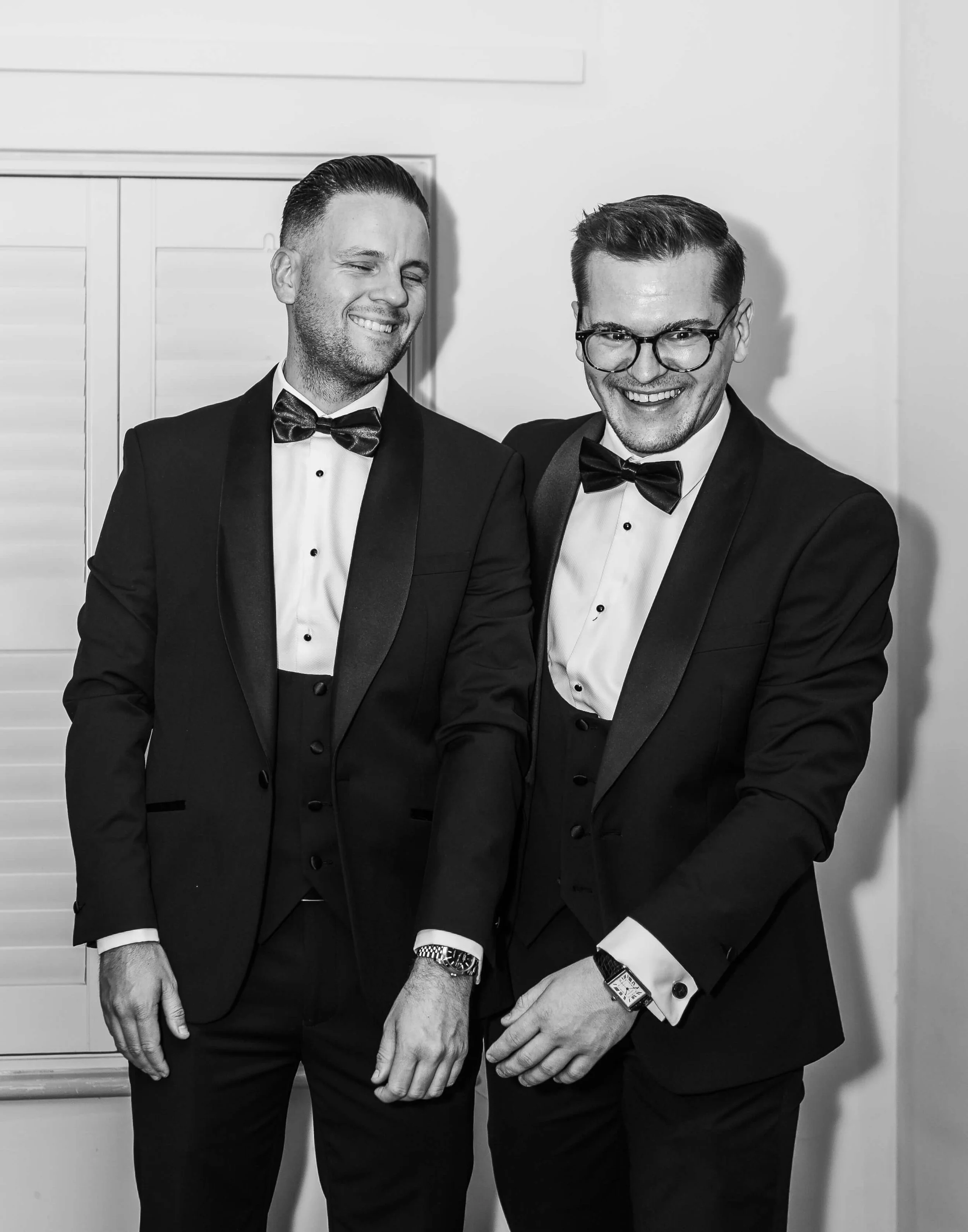 groom and best man laughing