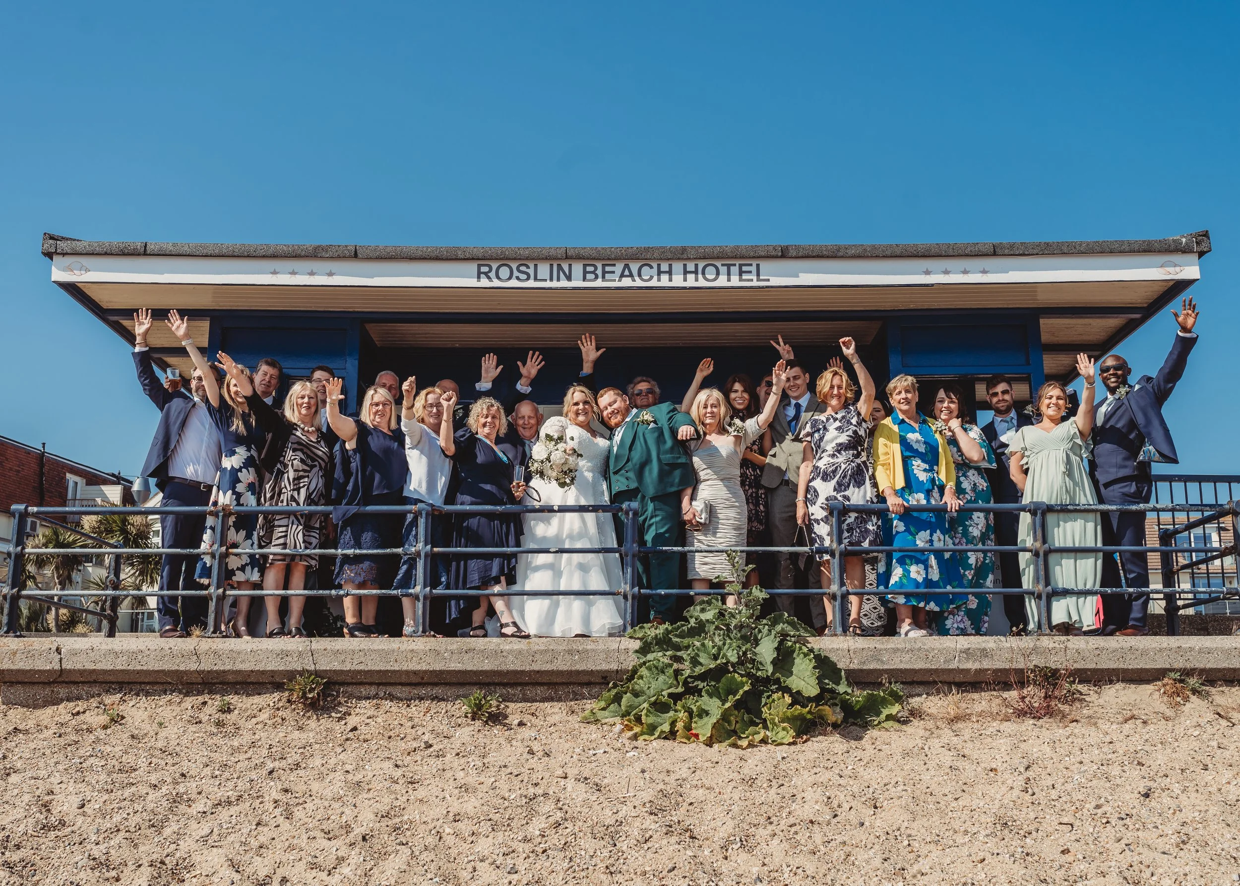 bride and groom party in shelter on Southend sea front outside the Roslin hotel