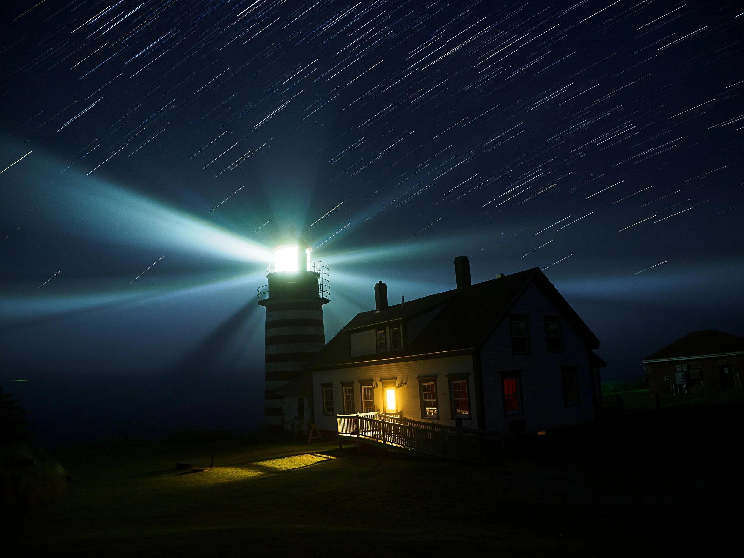 Star Trails over lighthouse

The ambient light and the lighthouse light were both frozen via live composite, allowing the image not to get overexposed from the lighthouse during the ~18-minute total exposure (15-second frames stacked in-camera on lgh