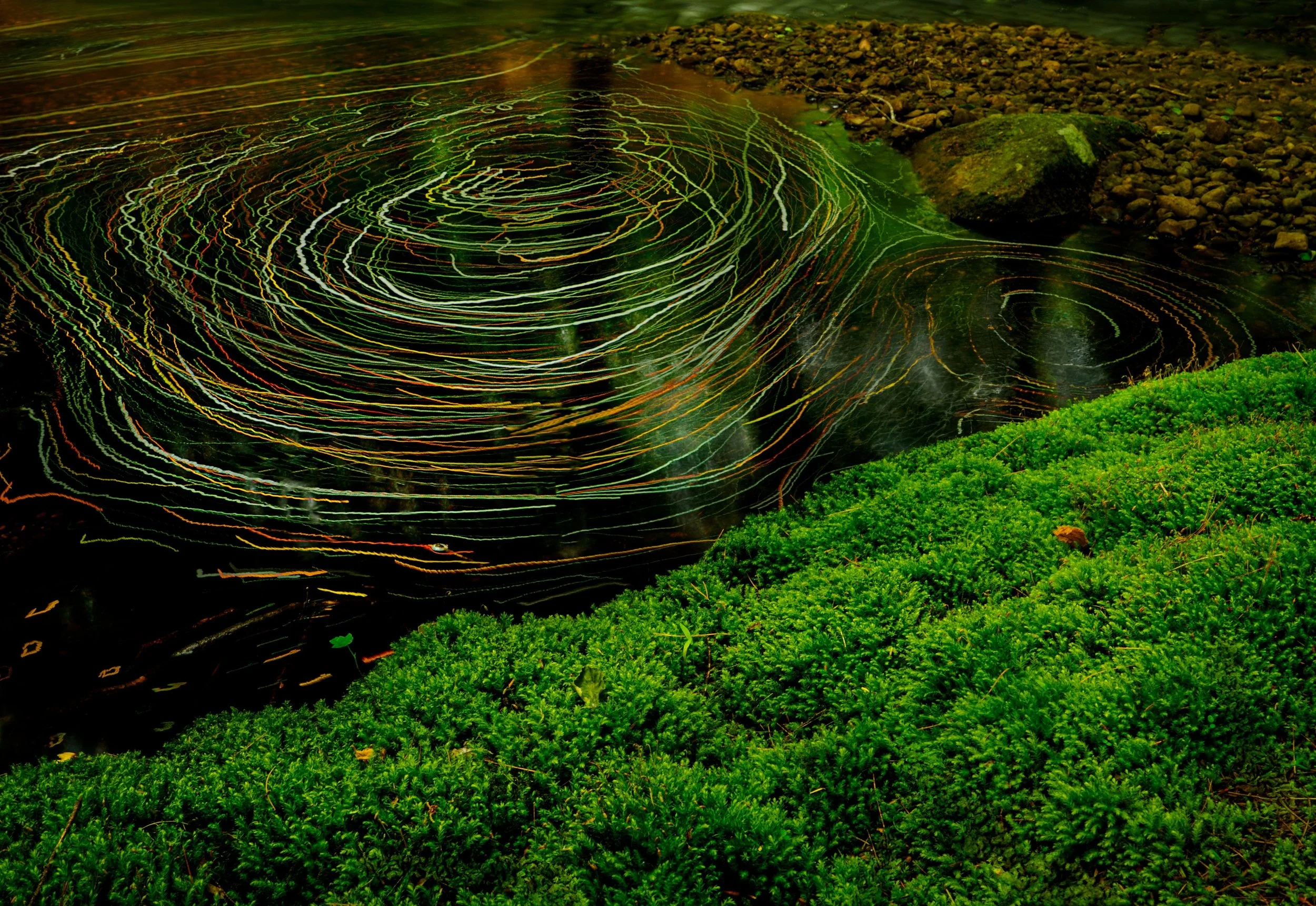 The River Flows...
even a slow moving water can be dynamic with foam and water moving in shapes unseen to the naked eye or single frame image.
This image was 240 1-second images stacked in-camera on lighten blend mode using daylight live composite fo