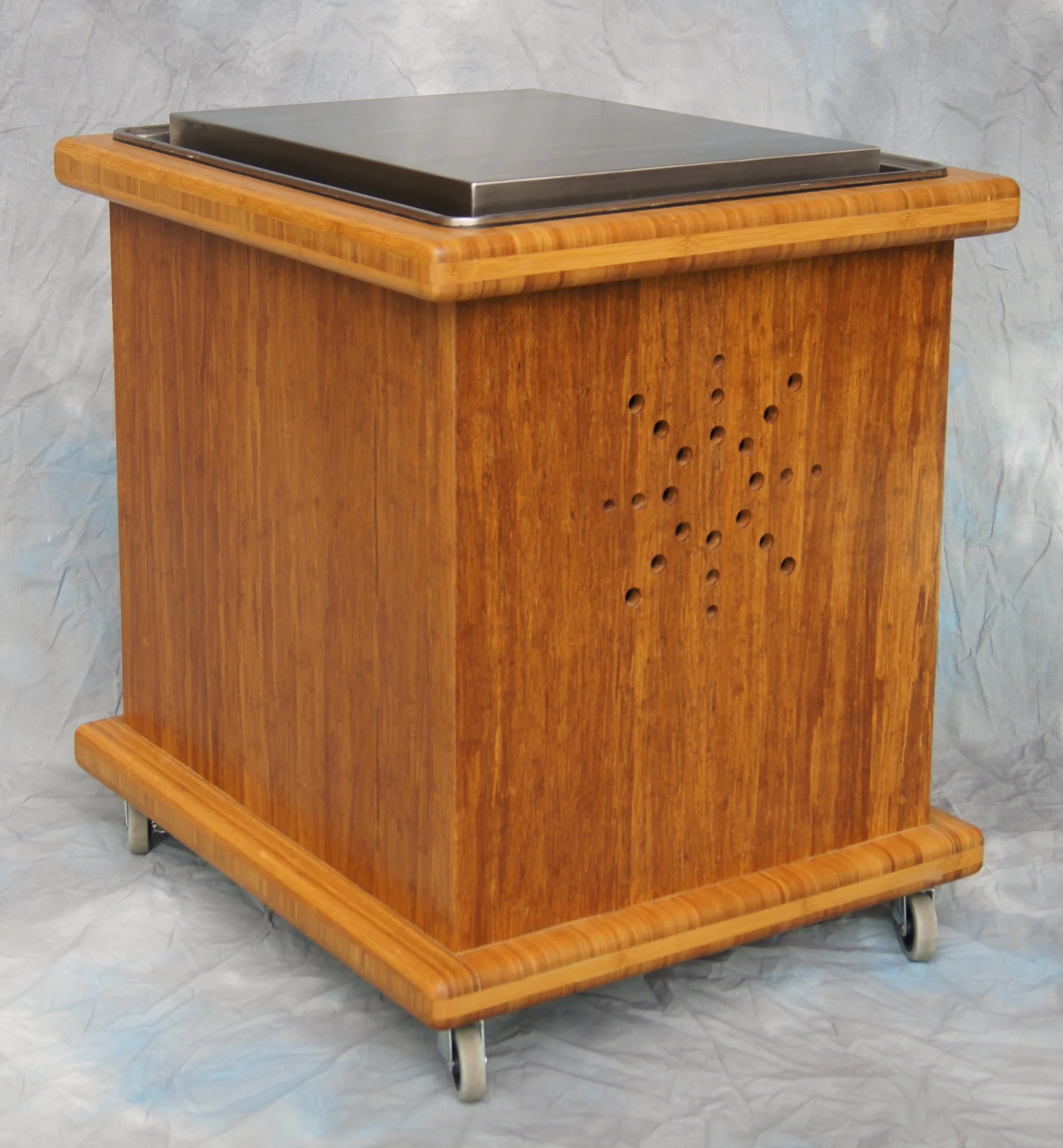 ^ A cooling plate mounted in a cabinet of strand bamboo plywood. It makes a great way to serve cake at a wedding or salad at a patio party!