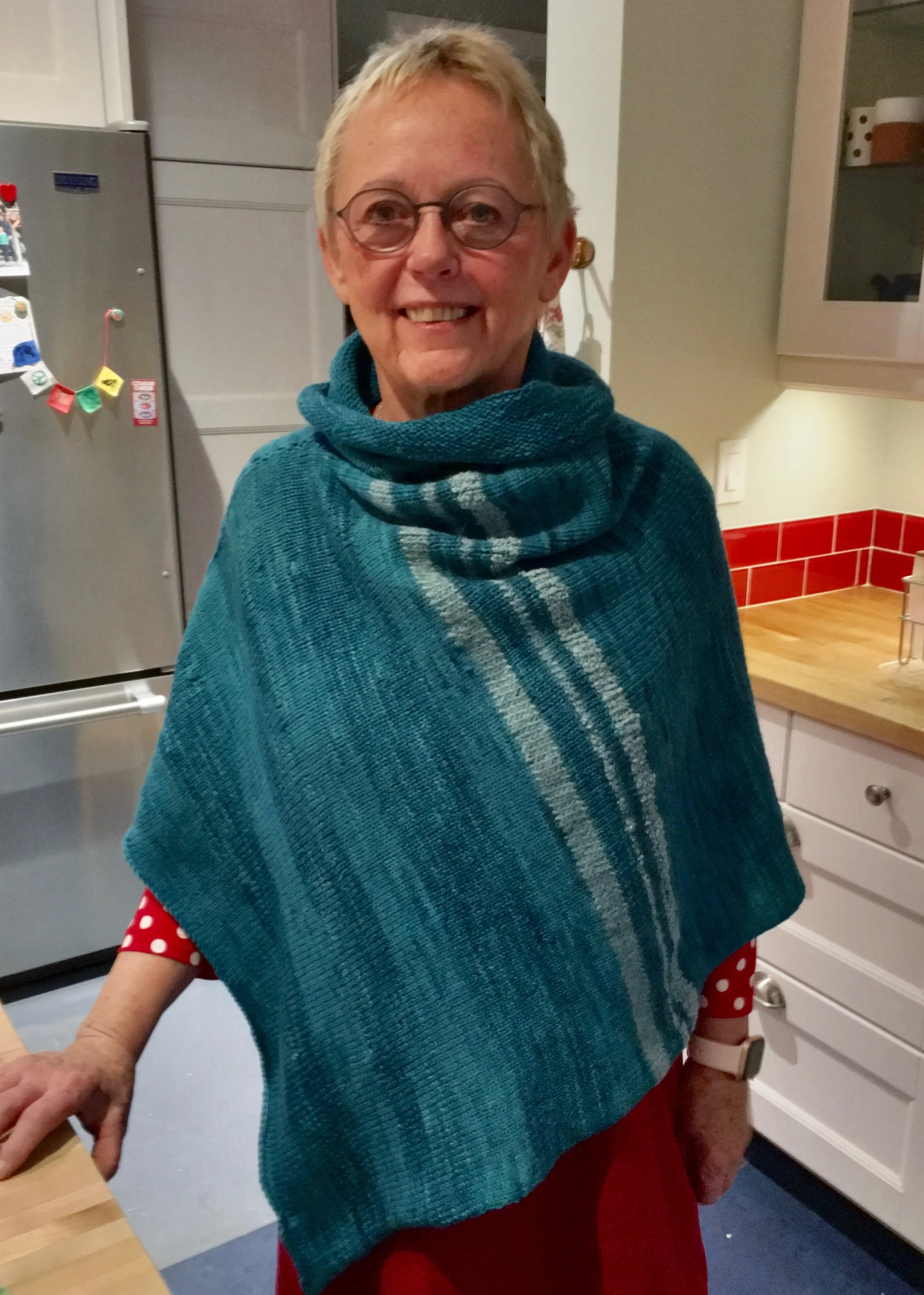Debbie modeling her poncho.