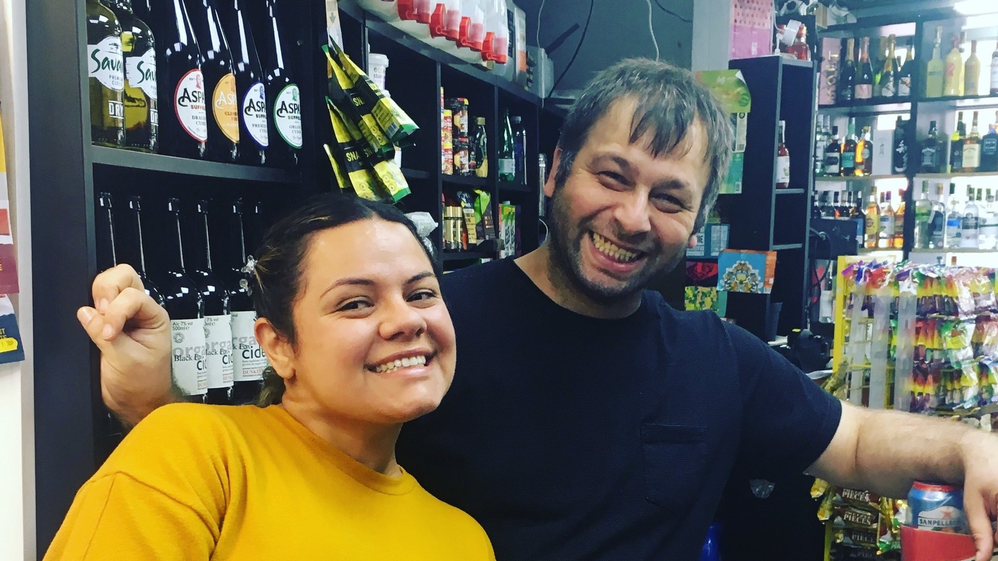 Adrienne and Okan posing under their eco refills :)