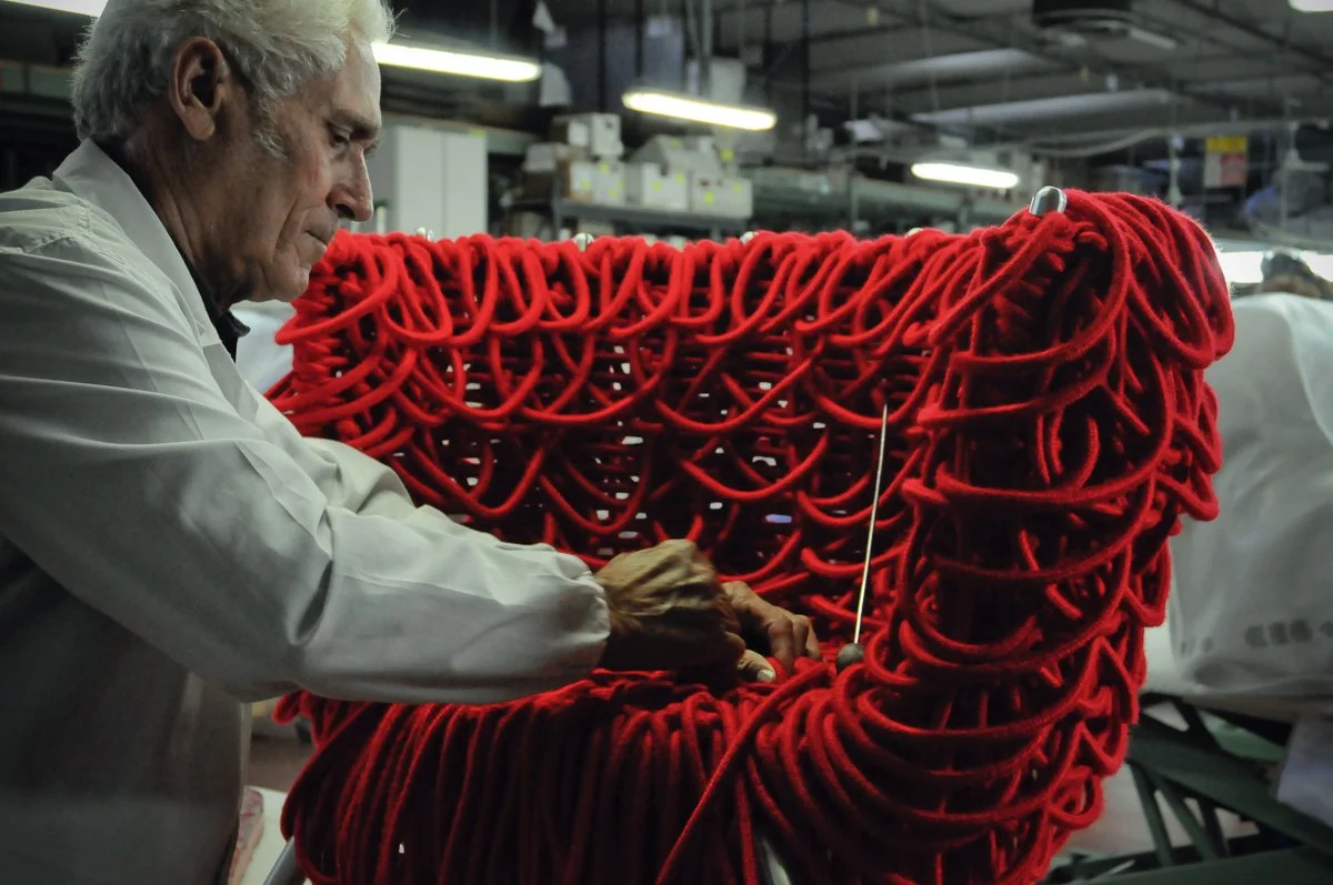 Edra Vermelha armchair handcrafted in red rope. Modern armchair. Statement piece for modern living room.